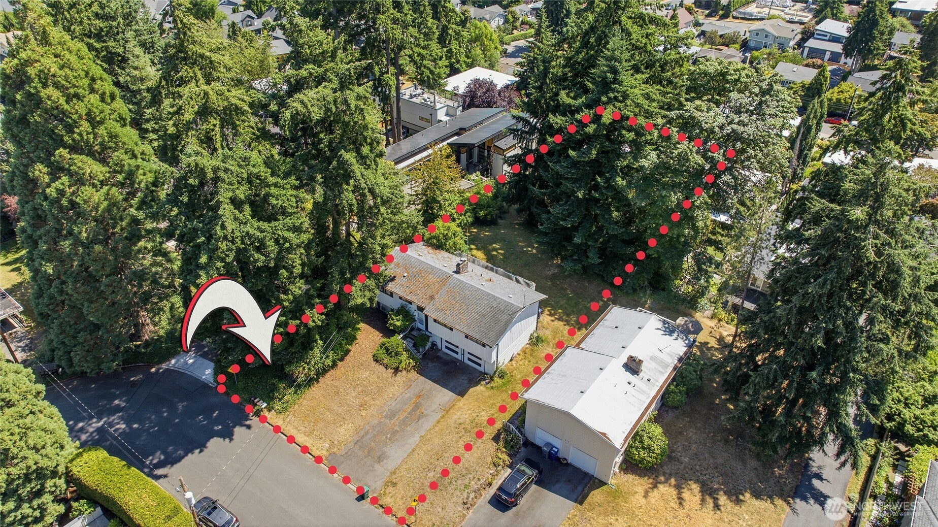 Prime development opportunity in the heart of Kirkland's Norkirk East of Market neighborhood. Just steps from Van Aalst Park, this 18,000 SF (.413-acre) property, zoned RS 7.2, offers exceptional potential to build a custom estate, renovate the existing home, explore cottage cluster development, or pursue subdivision potential (buyer to verify). Surrounded by established homes and luxury new construction, this premier location is just minutes from downtown Kirkland and the Lake Washington waterfront. Offered for the first time in more than 30 years, the existing 1963 split-level home features 1,770 SF with 4 bedrooms, 2.5 baths, original hardwood floors, and a finished lower level with separate exterior access. Renovate, expand, or start fresh with a custom luxury residence designed to maximize this exceptional homesite. Whether as a primary residence, investment property, or future development opportunity, this property offers outstanding flexibility in one of the Eastside's most sought-after neighborhoods. Conveniently located near downtown shopping, dining, waterfront parks, major employers, with easy access to Bellevue, Redmond, and Seattle. Situated within the highly regarded Lake Washington School District, large parcels of this size and location are increasingly rare. Home sold as-is. Buyer to verify all development potential, zoning, and permitted uses to their own satisfaction.