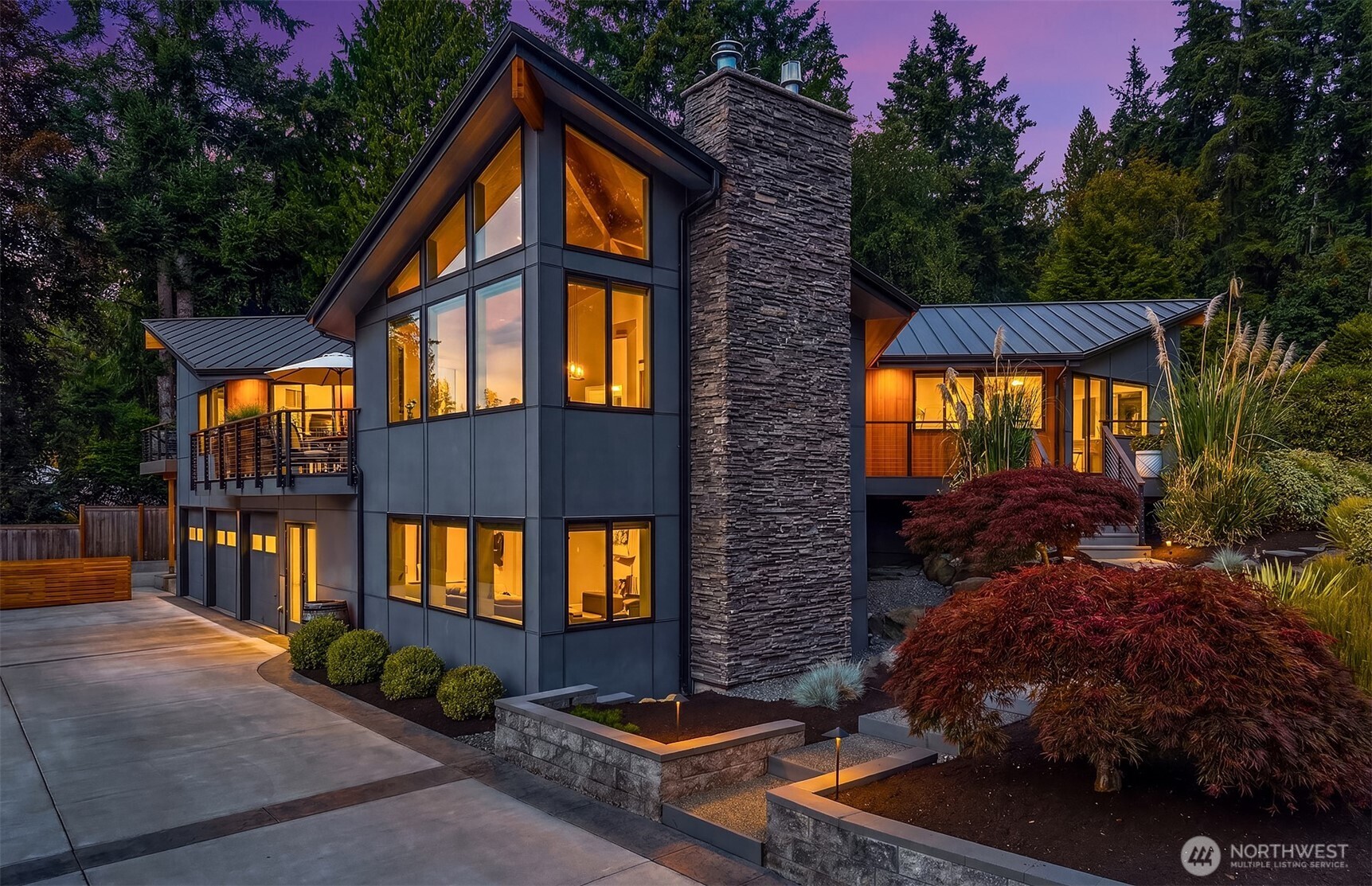 Proudly commanding attention at the crest of a quiet cul de sac, this exceptional 4,748-sq ft residence masterfully blends 1970s architecture with sophisticated modern updates. From the moment you step inside, the grand living room makes a lasting impression with soaring ceilings, a spacious dining room and a wall of windows that fills the home with natural light, the perfect space for holiday celebrations and unforgettable gatherings. The beautifully remodeled kitchen was designed for both everyday living and effortless entertainment. The oversized island, 2nd dining area, and inviting sitting room create a welcoming space where everyone naturally comes together. The luxurious primary suite offers a private retreat, complete with a relaxing soaking tub, dual vanities, a generous walk-in shower and access to a private deck to watch magical sunsets. The expansive lower-level lives like a home of its own, featuring an enormous family room, 2 additional bedrooms, gym, an updated bathroom and laundry. The generous living spaces provide exceptional flexibility, making this level equally suited for multigenerational living (ADU?), hosting guests, or creating dedicated work and recreation areas. The oversized three-car garage with an attached workshop, provides abundant space for vehicles, projects, storage, and recreation. An impressive display of well-appointed updates, while carefully maintaining the timeless character and architectural integrity from decades ago.