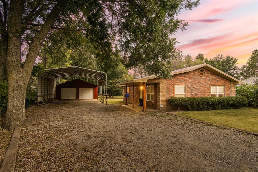 Welcome to 6712 NW 11th Street.  Sitting behind a gated entry, this updated home comes with an oversized detached 2-car garage plus an extended metal carport large enough for covered RV/boat/trailer parking. Bring the toys, the tools, the work trucks, you’ll have space for all of it.
Inside, the home has been thoughtfully remodeled. The fully remodeled kitchen features new cabinets, granite counter tops and stainless steel appliances. Exposed brick accents add character and a little rustic edge.
Both bathrooms have been renovated: one with a walk-in tiled shower and glass door, the other with a jetted tub/shower combo and updated tile surrounds. The updates don't stop there. Updated flooring, lighting, new paint, cedar accents are just a few of the recent updates.

If you’ve been looking for a property with a shop and RV parking capacity, updated interiors, and actual land without giving up convenience, this home checks every box. See it before it's gone! 

Owner Licensee: 176521