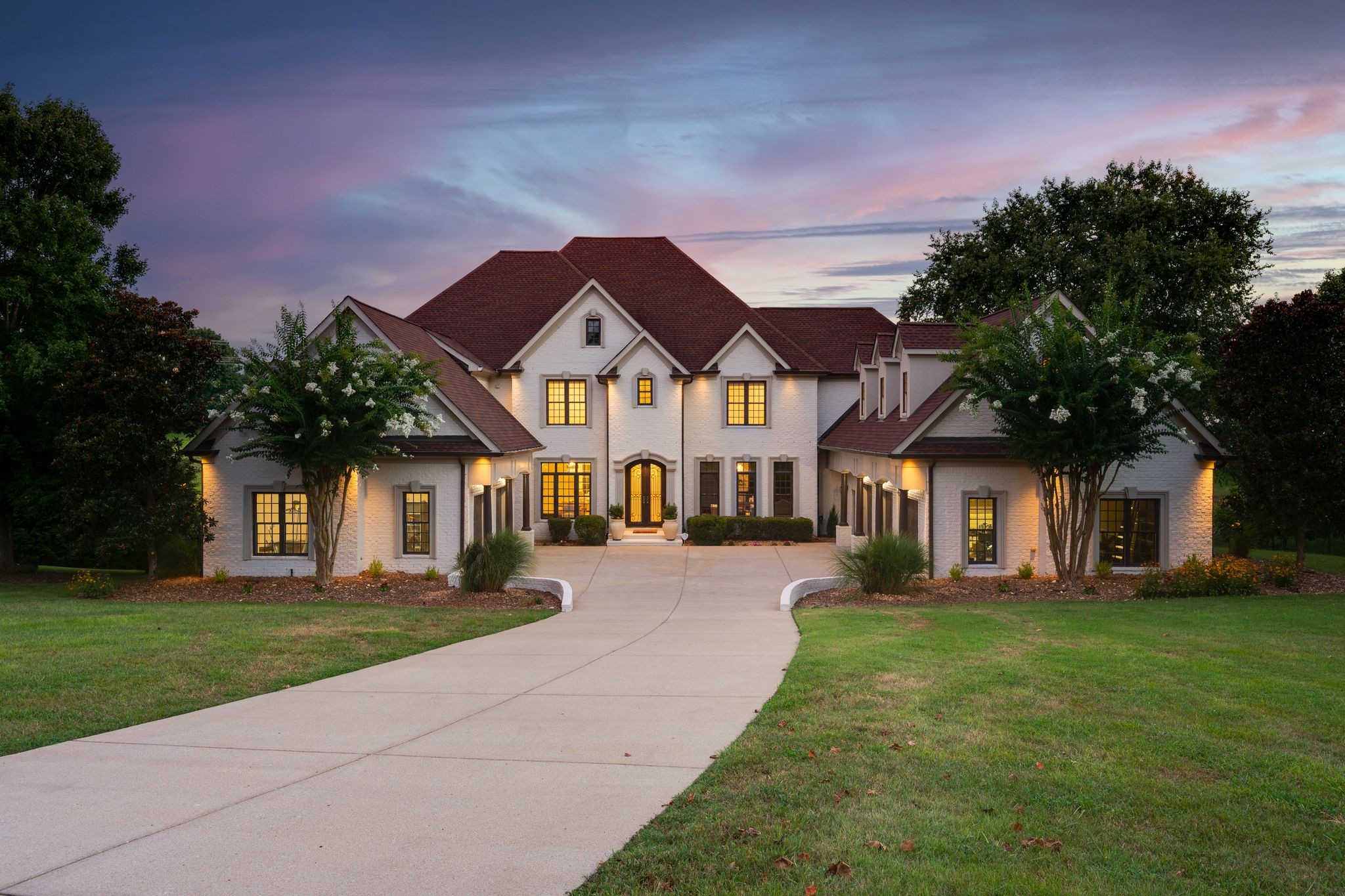 Indoor Pickleball?  How about Basketball?  Want to practice your golf game?   This incredible custom built home has recently had stylish renovations in the kitchen and family room.  Surrounded by almost 2000 SF of covered and screened back porches that look out onto an acre lot and small lake this home has  7 bedrooms and 7 full and 2 half baths.  Other features include a basketball/pickle ball indoor court, golf simulator, huge primary suite with a real spa tub (think athlete quality)  fireplace and one of the largest walk-in closets known to man.  Renovated kitchen has marble and quartz tile and custom everything including brand new top of the line appliances and a sexy coffee/wine bar.  Family room has 20ft soaring ceiling and a show-stopping floor to ceiling marble fireplace and fabulous built-ins including a full home theatre.  Cozy study/library.  Rec rooms and work out spaces in the tall ceiling walk out basement.  There is even a dog wash and dog run for your furry family members. Elevator shaft. Enormous attic/future expansion.  5 car garage and so much more.  Don't miss this one!  Sensibly priced for quick sale.