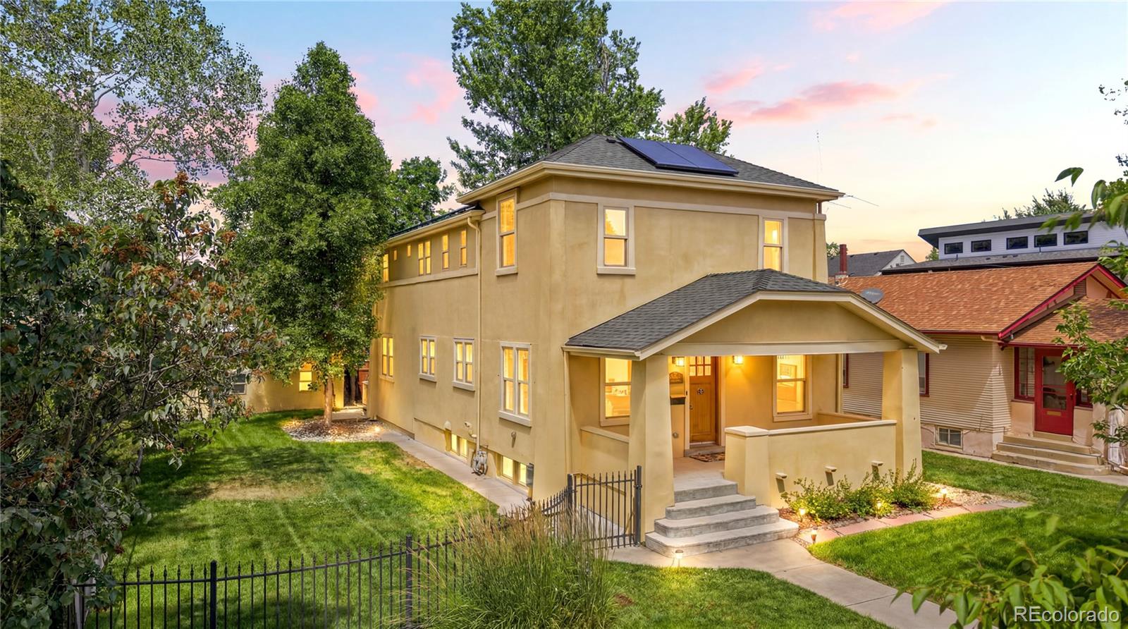 Beautifully renovated two-story home on an oversized lot in the heart of Platt Park, just blocks from South Pearl Street’s shops, restaurants, and farmers market. Bathed in natural light from its southern exposure, this home combines timeless elegance with modern upgrades.Designed for entertaining, the open-concept main level features a gourmet kitchen with high-end appliances flowing seamlessly to the spacious living and dining areas. French doors lead to an expansive back deck overlooking a huge yard—perfect for kids, pets, and Colorado evenings. A private study and convenient powder room complete the main floor.Upstairs, the primary suite boasts vaulted ceilings, a custom walk-in closet, and a spa-inspired five-piece tumbled marble bath with a double-head shower. Two additional bedrooms feature remodeled custom closets and share a spacious bath with dual sinks.The finished basement offers exceptional flexibility with custom built-ins, a cozy fireplace, a wine chiller and separate beverage fridge, a guest bedroom (or home gym/office), and a full bath with a double-head shower featuring a built-in steam function.Extensively updated, the home features fresh interior/exterior paint, premium 100% wool carpet on the upper levels, and Washlet bidet toilets in every bathroom.The owned solar system will be fully paid off at closing, providing long-term energy savings with no lease or loan obligation. The detached garage is EV-ready with a dedicated 240V outlet. This exceptional property offers a rare combination of luxury finishes, modern efficiency, and an unbeatable location in one of Denver’s most sought-after neighborhoods.