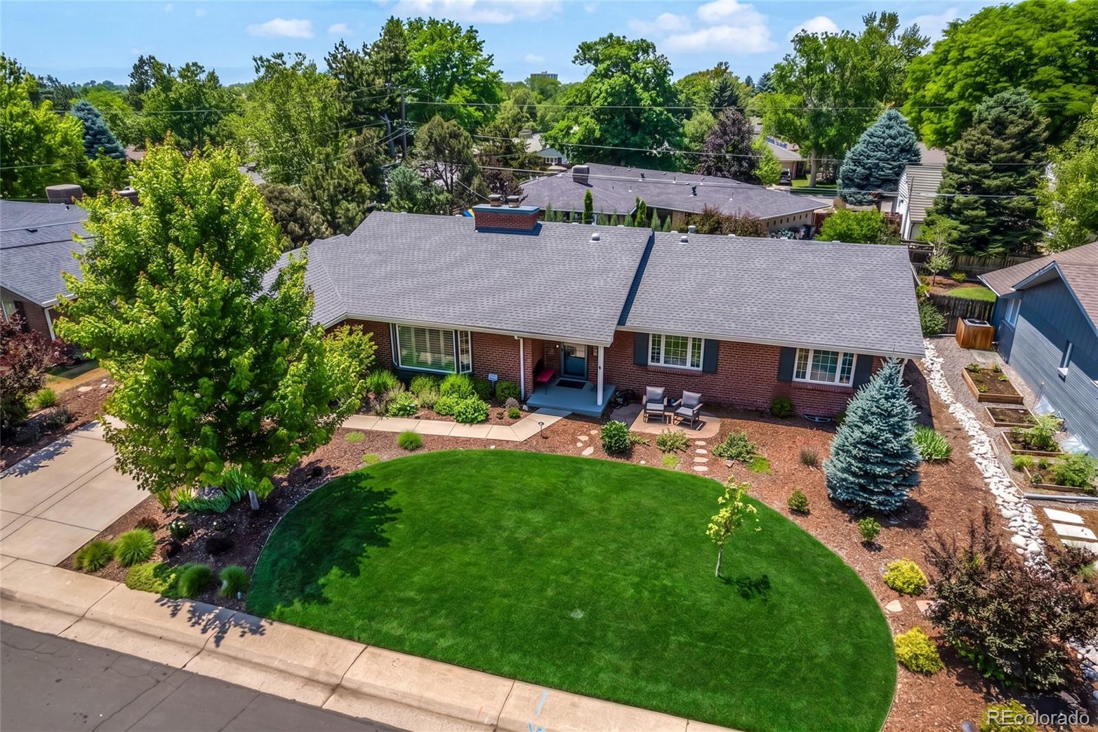 A rare find in Southern Hills. Main-level living, a dedicated office, a finished basement, and a fenced backyard rarely come together in one property—this property has all four, on one of the neighborhood's most sought-after tree-lined streets.Step inside and the open-concept living room, dining room, and kitchen are anchored by a double-sided fireplace. Hardwood floors, skylights, shutters, and custom closet built-ins carry natural light throughout the main level. A dedicated office and mudroom addition offers flexible space for remote work, hobbies, or everyday organization. The primary suite is a true retreat. A fully renovated primary bathroom with designer finishes, updated fixtures, and thoughtful detail work — a standout upgrade that sets this home apart. A newly custom-built primary closet rounds out the suite, combining function and polish in equal measure.Outside, a deck with a dedicated grilling area, a flagstone patio, mature landscaping, and multiple gathering spaces turn the fenced backyard into an extension of the living space. This 4-bedroom, 3-bathroom ranch has had only three owners since it was built in 1956. Three bedrooms and two bathrooms sit on the main level, with a fourth conforming bedroom and bathroom in the finished basement, which also includes a large recreation room, guest space, and additional storage. Just 0.3 miles from Slavens K-8 and minutes from neighborhood bike paths, the home is close to Wellshire Golf Course, the University of Denver, Cherry Creek, the Denver Tech Center, and downtown, with easy access to restaurants, coffee shops, grocery stores, parks, and major commuter routes. The list of recent updates is long: a fully renovated primary bathroom with premium finishes, a newly custom-built primary closet, newer HVAC systems, a new hot water heater, a new roof, new skylights, fresh exterior paint, updated lighting, and landscaping upgrades.