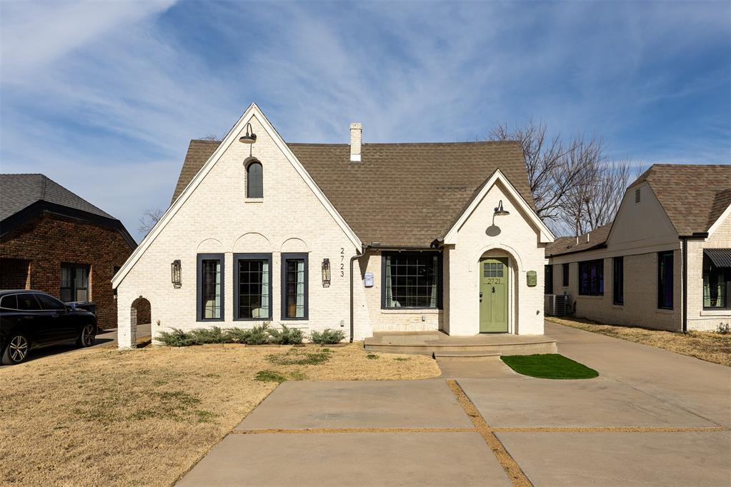 Introducing a one of a kind duplex in the historic Crestwood neighborhood. This property underwent a complete renovation in 2018 thoughtfully restoring the charming, original features such as the fireplaces and hardwood floors, while modernizing the kitchens, bathrooms, systems, and functionality of the spaces. Upon entering, your eyes will wander upwards towards the over 17 ft tall ceilings, mirroring the pitch of the tall, Tudor style architecture. The design elements will not disappoint you including custom light fixtures, a decorative stairway to an open loft, arched entries and hallways, and hand picked finishes throughout. Residents will enjoy an open concept kitchen complete with custom cabinetry, quartz countertops, stainless steel appliances, and pantry, the spacious bathroom with decorative ceilings and large walk-in showers, and the bedroom with vaulted ceilings, walk-in closet, laundry, and a door to a private, separated backyard for each unit. The street offers a large median for neighbors to share, and the location, currently within  the highly rated Cleveland Elementary school district, is convenient for accessing entertainment districts such as the Plaza, Paseo, Uptown 23rd, and major highways. The occupied unit #2723 currently leases for $1600 per month. #2721 is vacant for showings.