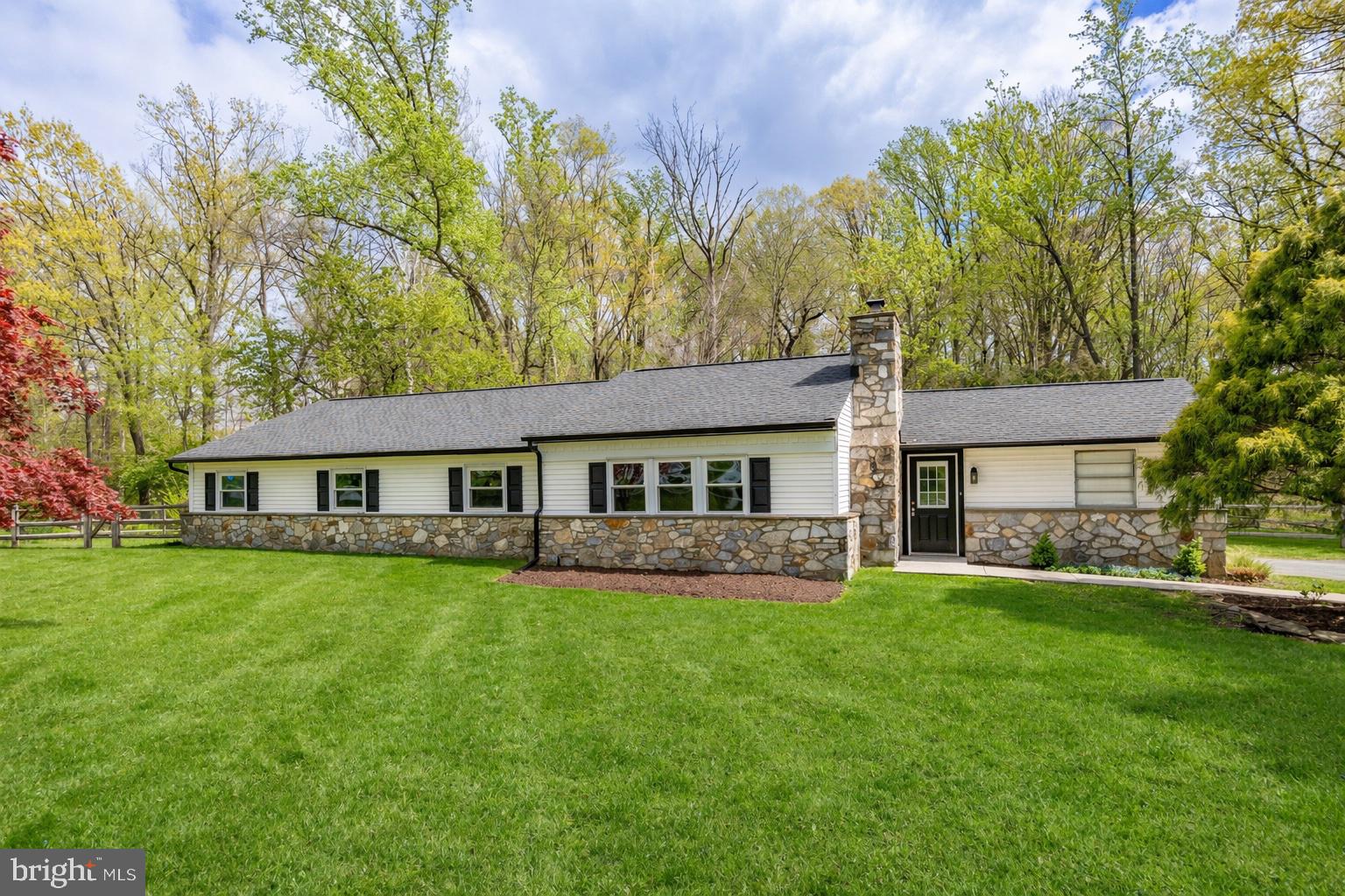 Located in the highly acclaimed Downingtown Area School District, including the renowned STEM Academy, this inviting ranch home offers the ease of one-floor living on a private 1+ acre homesite set well back from the road. With charming stone accents and exceptional curb appeal, this property is as welcoming on the outside as it is on the inside. Step inside to discover a spacious 4-bedroom, 2-bath layout highlighted by beautiful hardwood floors and a flowing, open-concept design. The living and dining areas are filled with natural light from oversized windows, creating a warm and airy feel perfect for everyday living and entertaining. The kitchen offers abundant workspace, pantry storage, new stainless-steel appliances, and a center island for added versatility. The primary suite includes a full bath and generous closet space, while three additional spacious bedrooms with ample closet storage offer flexibility for guests, an office, or hobbies. A well-placed hall bath serves both the bedrooms and main living areas. The sliding door off the dining area opens to a covered patio overlooking the fully fenced backyard, an ideal setting for outdoor dining, gardening, play, or simply enjoying the peaceful surroundings. The expansive yard offers privacy and plenty of room to roam. Additional highlights include a side-entry one-car garage, storage area, spacious lower level with laundry, and a professionally waterproofed basement. Comfort is covered year-round with two heating options—hot-water baseboard heat from a newer boiler, plus an efficient heat pump that also powers central air. A large storage shed provides even more room for tools and outdoor equipment. Ideally located near major routes, the PA Turnpike, shopping, dining, parks, and trails, this lovingly maintained home combines privacy, convenience, and everyday comfort in one exceptional offering.