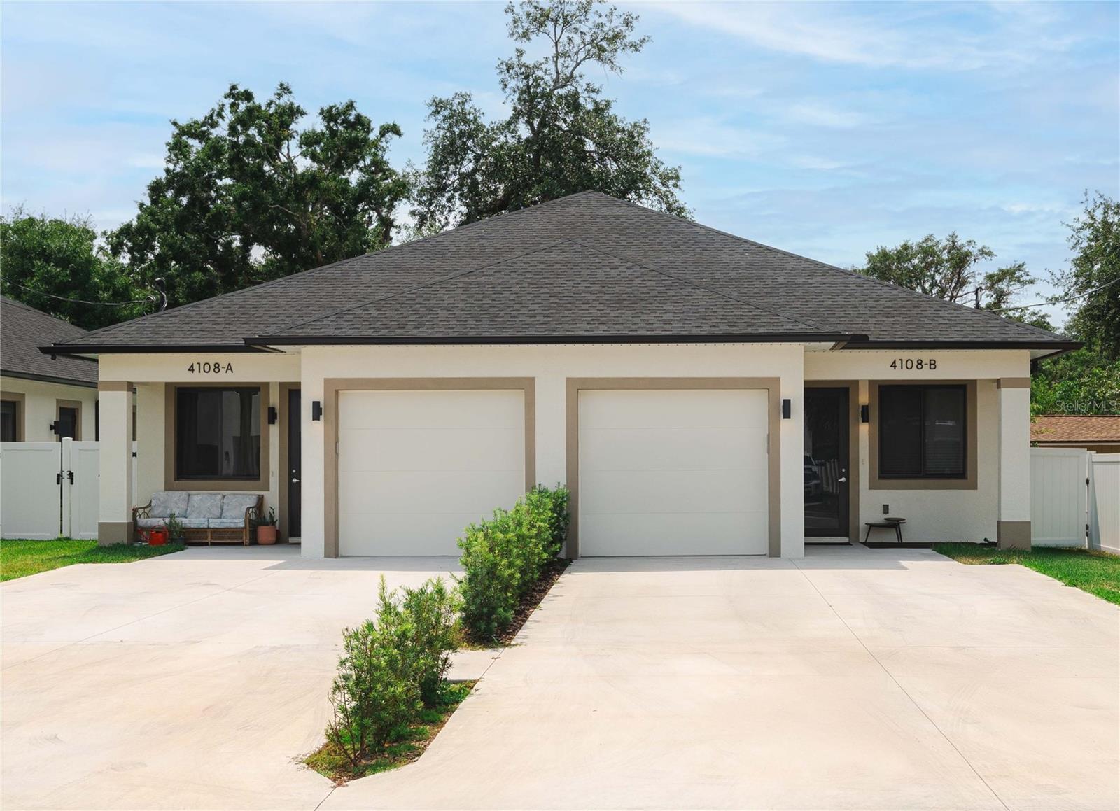 Turnkey Tenant-Occupied Duplex – 2024 Construction in High-Demand Drew Park Investor-ready and fully leased! This 2024-built duplex in Tampa’s centrally located Drew Park offers immediate cash flow with existing tenants in place. Each unit features a modern 3-bedroom, 3-bath villa layout with a 1-car garage—designed to appeal to today’s renters seeking privacy and functionality. Each spacious bedroom includes its own private en-suite bathroom, significantly boosting rental potential, especially for shared living or student housing scenarios. The open-concept layout includes a contemporary kitchen with island seating, abundant cabinetry, and a complete set of brand-new stainless steel appliances: French door refrigerator, smooth-top range, dishwasher, and microwave hood. Additional investor-friendly highlights: Fully fenced backyards and parking for 3 vehicles unit Washer/dryer hookups in each garage Modern finishes throughout Water, sewer, trash, and lawn care included in rent Tenants benefit from an optional Resident Benefits Package (utility concierge, filter delivery, maintenance portal) Located just steps from Hillsborough Community College and close to Tampa International Airport, International Plaza, and major highways, this property is ideally positioned in one of Tampa’s most active rental markets. This is a low-maintenance, opportunity perfect for investors seeking immediate returns and long-term growth in a prime location.