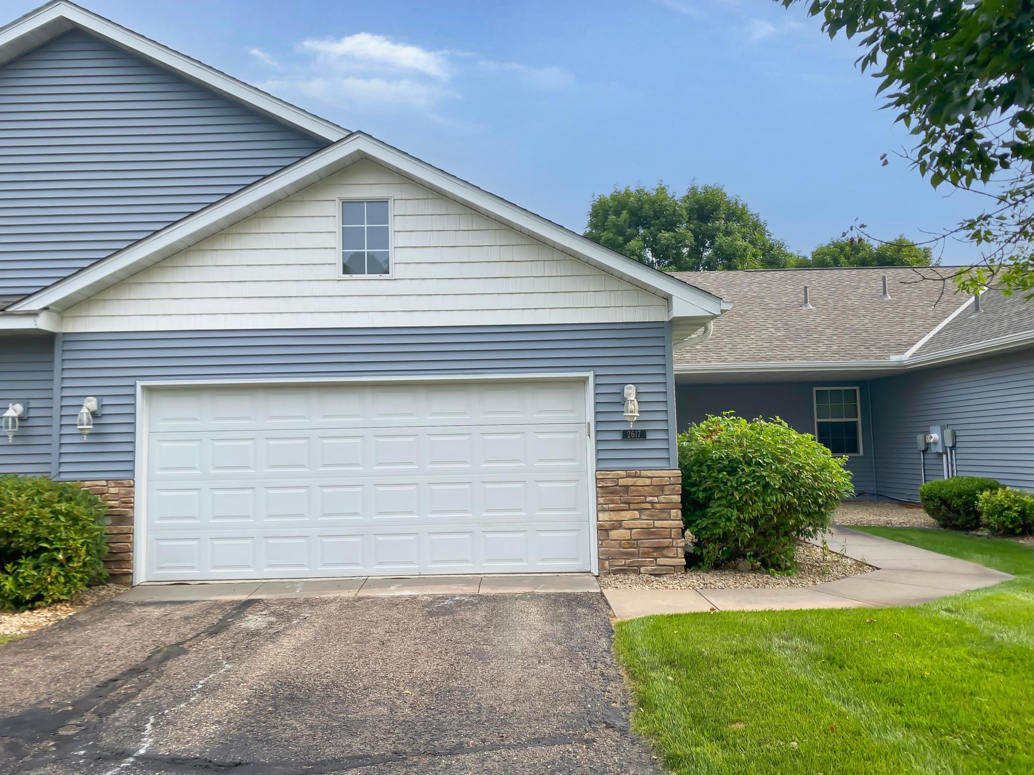 This rambler-style townhouse offers four bedrooms and two bathrooms with vaulted ceilings and an open concept. The kitchen features stainless steel appliances and a center island. Enjoy two main floor bedrooms along with main floor laundry. The finished basement offers flexible space for recreation, storage, and additional sleeping quarters. Fresh, neutral paint and carpet throughout. Move-in ready. Some photos have been virtually staged.