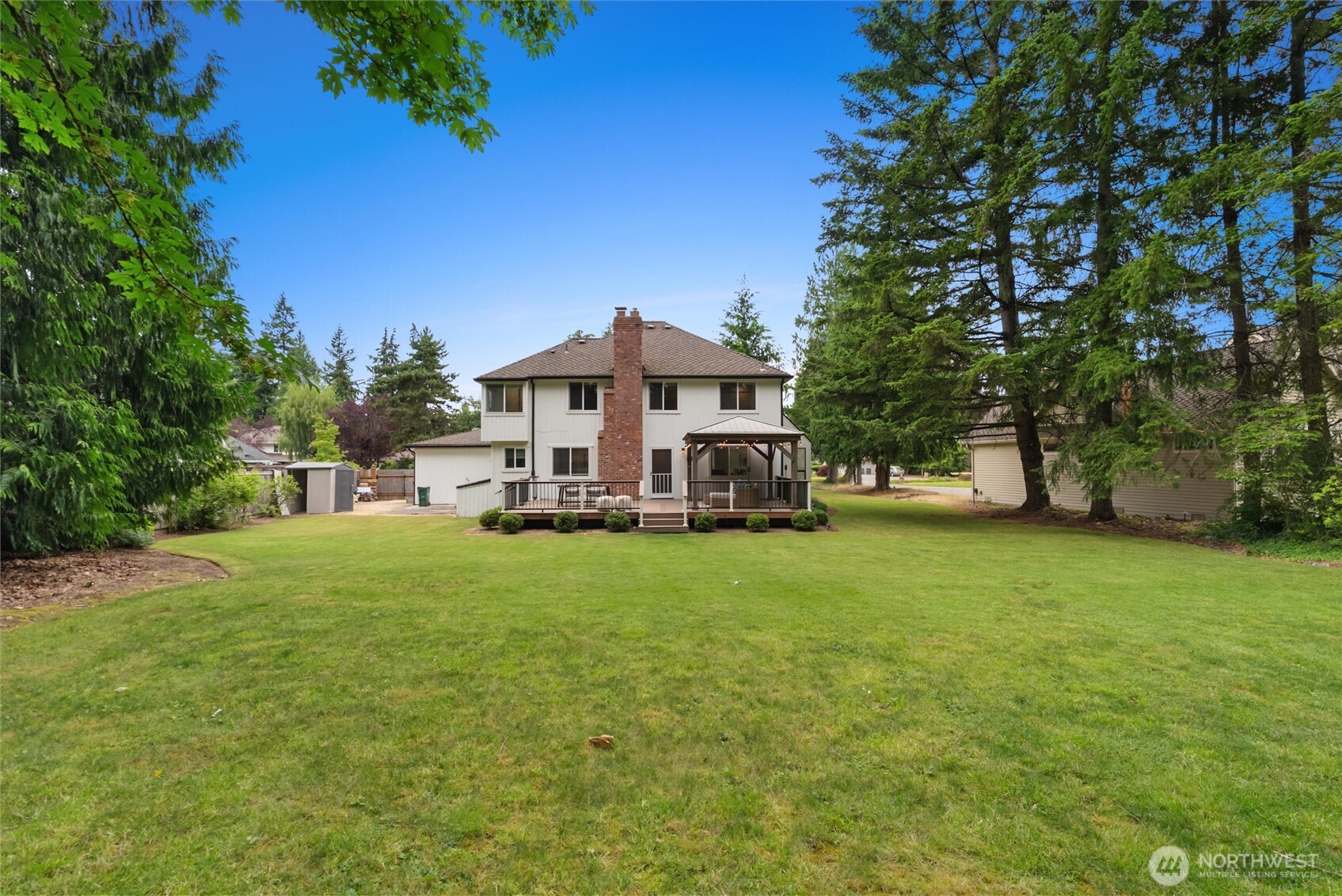 Welcome to The Ridge at Fairwood, a sought-after neighborhood known for its beautiful homes, generous lots, mature landscaping, and peaceful surroundings. Set on nearly half an acre and backing to a permanent greenbelt, this 3-bedroom + office, 2.5-bath home offers exceptional privacy and space. Grand double doors open to soaring vaulted ceilings and an airy layout with refinished hardwood floors and brand-new carpet. The spacious kitchen features granite countertops, gas cooktop, pantry pullouts, garden window, and a large center island, opening to the family room with gas fireplace. Upstairs, the primary suite offers a walk-in closet, gas fireplace, and 5-piece bath with soaking tub and separate shower. Two additional bedrooms, a remodeled guest bath, and versatile open loft complete the upper level. Outside, enjoy a private Northwest setting with no homes directly behind, a TimberTech deck, gazebo, expansive yard, and lush greenbelt backdrop. Complete with a dedicated office and 3-car garage, plus convenient access to parks, trails, shopping, freeways, and Sea-Tac Airport. A special opportunity to call The Ridge at Fairwood home.