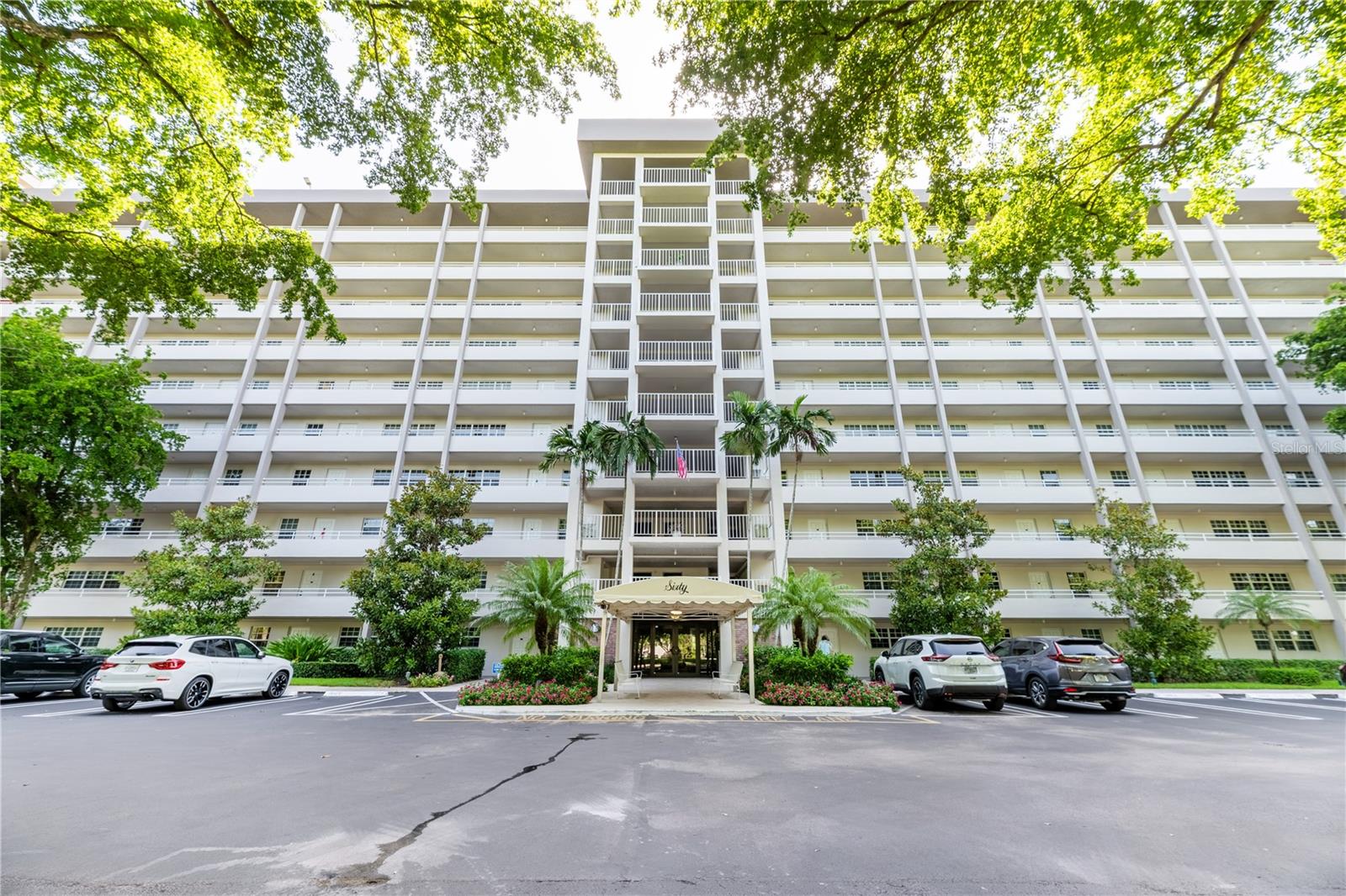 Virtually Staged. COMPLETED MILESTONE INSPECTIONS, IMPACT WINDOWS, GOLF COURSE VIEWS & EXCEPTIONAL VALUE IN PALM-AIRE COUNTRY CLUB. Bright and spacious sixth-floor 2-bedroom, 2-bath original condition condo offering the opportunity to update and personalize to your own style and budget. Why pay a premium for someone else's renovations when you can buy the location and create a home that's uniquely yours? Features include impact-resistant windows throughout, in-unit washer and dryer, generous living areas, a functional split-bedroom floor plan, and tranquil golf course views. The secure building offers controlled lobby access, assigned parking, guest parking, and security patrol. Buy with confidence knowing the condominium has successfully completed all required structural and milestone inspections and maintains reserve funding. HOA dues include water, cable, high-speed internet, pest control, reserves, and exterior maintenance. Palm-Aire amenities include two heated pools, tennis and pickleball courts, a fitness center, walking paths, and pay-and-play access to three championship 18-hole golf courses. Minutes from Harrah's The Pomp, shopping, dining, parks, and just 15 minutes to the beach. Ideal as a primary residence, seasonal getaway, or investment property. One of the best value opportunities in Palm-Aire. Schedule your private showing today!