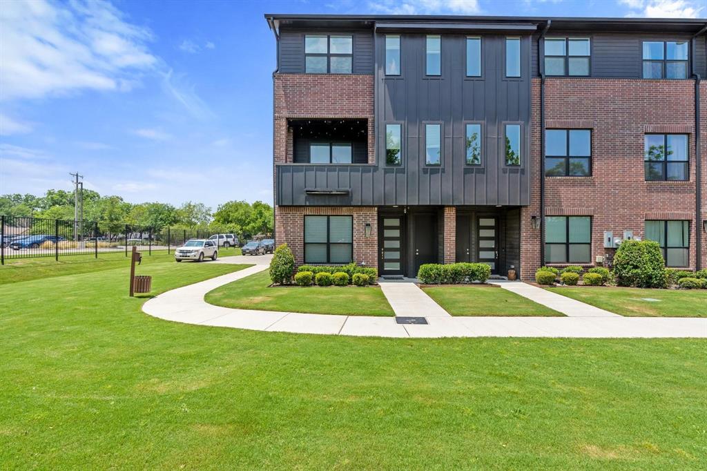 Discover urban living at its finest in this three-story townhome, ideally situated near downtown, TCU, bustling bars, and more. Positioned on a corner lot, this residence offers a unique layout and captivating features. Upon entry, you're greeted by a welcoming first secondary bedroom with its own private ensuite, providing comfort and convenience for guests or family members. Ascend to the second floor, the heart of the home, where a spacious living area, well-appointed kitchen, and convenient half bathroom await. Step onto the fabulous patio and soak in breathtaking views of downtown, perfect for entertaining or relaxation. The third floor boasts additional bedrooms, each with a private ensuite for ultimate comfort. The second secondary bedroom offers a cozy retreat, while the expansive primary bedroom impresses with a built-in office and luxurious ensuite bathroom, creating a serene haven.