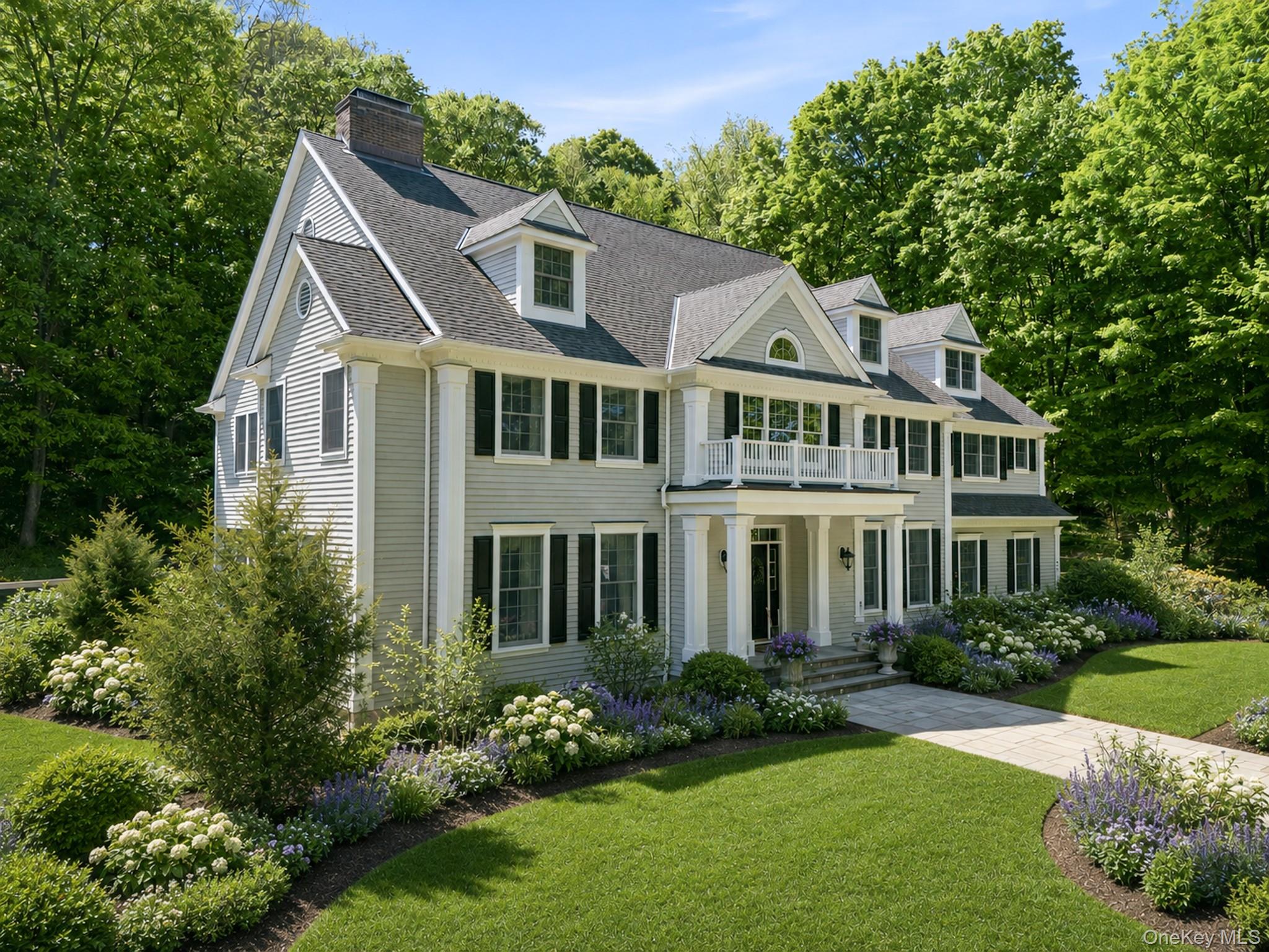 Handsome and classic 5 bedroom center hall colonial set along much sought after Old Stone Hill Road.  Superbly crafted, the house is flooded with natural light through abundant oversized windows.  At the heart of the home is a wonderful family room with fieldstone fireplace.  Adjacent is the center island kitchen with stainless steel gas Viking cooktop and Viking double wall ovens.  The two story entry is flanked by the formal living room with adjoining butler's pantry and formal dining room adjacent to a built-in wine center. The primary suite is under a tray ceiling and features two walk-closets-outfitted  in custom cabinetry, a luxurious primary bath with double sinks, shower, and soaking tub and a private office. Four additional second floor bedrooms all have adjoining baths. The lower level centers on a nicely finished playroom with gas fireplace, home exercise room, full bath and storage rooms.   A lovely two-level stone terrace with fire pit is surrounded by established  perennial gardens and a naturalized wildflower meadow.  Just minutes from Pound Ridge's vibrant hamlet of Scotts Corners and the 4,000 acre Ward Pound Reservation,  77 Old Stone Hill is a wonderful opportunity to live your best life in beautiful  Pound Ridge.