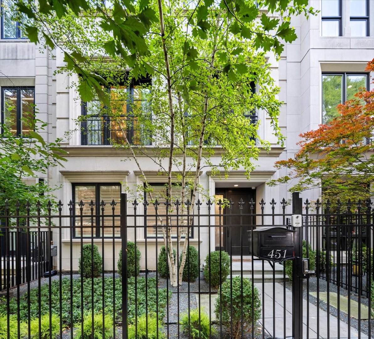 A rare opportunity to own a 5,245-square-foot single-family home with direct interior access to the exceptional amenities of 2550 N. Lakeview. Set on coveted Deming Place, this extra-wide, six-bedroom residence combines the privacy, space and outdoor living of a single-family home with the services, security and amenities of a premier full-service building, all accessible without ever stepping outside.  One of the home's most distinctive features is its exceptional connection to outdoor space. The kitchen and great room open directly to the home's own private terrace, which in turn leads to 2550 Lakeview's expansive 1.25-acre private park, an extraordinary extension of the home's backyard. Residents also enjoy the children's playground and dog park, along with the full complement of 2550 Lakeview amenities, including an indoor pool and hot tub, fitness center, sauna and steam rooms, Pilates studio, sun deck, recreation room, library, private party room, receiving room, dry cleaning services, daily garbage pickup, 24-hour security and professional building staff. The residence is exceptionally well designed across four levels, all served by a private passenger elevator. The entry level offers a gracious foyer with extensive built-in storage, an at-grade guest suite or home office with full bath, and a fully outfitted mudroom with direct access to the home's private attached two-car garage. Two additional deeded garage spaces provide an extraordinary total of four indoor parking spaces. The main living level is bright and generously proportioned, with large windows overlooking Deming Place. Spacious living and dining areas connect to the kitchen and great room through an oversized butler's pantry complete with walk-in pantry, coffee bar, wine center and desk area. The eat-in kitchen features custom cabinetry, commercial-grade appliances, two dishwashers and quartzite countertops and opens to a family room with fireplace and custom built-ins. Just beyond is a large private terrace with direct access to the park. The bedroom level is anchored by a substantial primary suite with a separate dressing room, two walk-in closets and spa bath featuring heated floors, freestanding tub and oversized steam shower. Two additional bedrooms, a full bath and a walk-in laundry room complete this level. The upper floor offers two additional bedrooms, a full bath, powder room and large recreation room with wet bar opening to a second private terrace. Soaring ceiling heights, extensive custom millwork and built-ins, Control4 integrated audio, lighting and security complete the residence. An exceptional combination of single-family living, multiple private outdoor spaces, four-car indoor parking and seamless access to 2550 Lakeview's 1.25-acre park, amenities and services in one of East Lincoln Park's most desirable locations.
