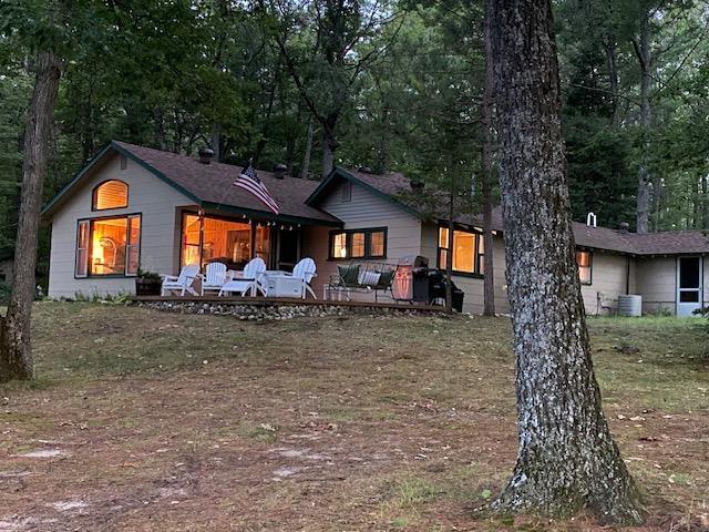 Don't miss out on the 3D tour, click on the virtual tour! This charming 4-bedroom, 2-bathroom cottage offers a serene retreat on the picturesque Gee Lake near Lewiston. Perfectly positioned with 480 feet of lake frontage, the property boasts a clear, swimmable lake ideal for fishing and peaceful relaxation. The single-level cottage features a cozy living room centered around a beautiful fireplace with lake views. It's in great shape and move-in ready, complemented by a 2-car detached garage and an additional children's playhouse. Enjoy the quiet, pleasant surroundings and the seclusion provided by the private drive leading to the cottage. Possible fully furnished and turnkey cottage ready to enjoy the summer. There are cameras on the grounds and in the home. Hardwired DSL internet, the line is already in existence from the main road and they get 15gigs of streaming and use. The Internet provider is Frontier Internet services.