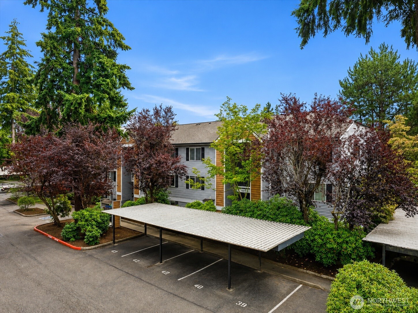 Live at the center of everything Bellevue has to offer—then come home to a beautifully refreshed condo that feels bright, modern & effortlessly comfortable. The north facing unit features abundant natural light, thoughtful updates & an exceptional location creating a lifestyle built around convenience. Step inside to discover hardwood floors, brand-new carpet, modern light fixtures & new bathroom mirrors, giving the condo a fresh, polished feel. The modern kitchen features Shaker-style cabinetry, slab granite counters, ss appliances, pantry storage & generous workspace, flowing seamlessly into the dining & living areas. A cozy fireplace adds warmth & character, while the spacious primary retreat offers privacy & an en-suite bath. The additional bedroom creates flexibility for guests, a home office or everyday living. A full-size laundry room w/extra storage adds rare condo convenience. Outside, the sunny south-facing patio invites morning coffee, summer dinners & weekend BBQs. Across the street, Crossroads Bellevue brings shopping, dining, entertainment & everyday essentials within easy reach + Crossroads Park nearby. Enjoy Ironwood's clubhouse, recreational outdoors & fitness center. HOA dues include water, sewer, garbage, common-area maintenance & earthquake insurance. **NO RENTAL CAP** offers valuable future flexibility. Minutes to Microsoft, DT Bellevue, transit & major Eastside connections. Move-in ready, wonderfully connected & designed for an easy Bellevue lifestyle!