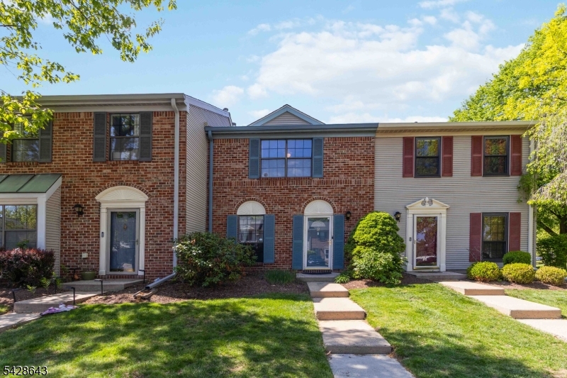 Lovingly maintained and updated unit with newer stainless steel appliances, newer vinyl flooring though out, Freshy painted, Granite counter tops and tiled backsplash. Recessed lighting, brick wood burning fireplace updated bathrooms with newer tile floor. Sliding glass door to patio. Great community.