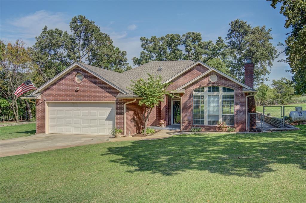 **Open House Sunday, September 14th 2-4PM**  Fantastic home with covered large back patio overlooking beautiful 1.5 acre lot! Very well maintained 3 bedroom, 2 bath with storm shelter. Master bathroom has been updated with new shower and soaker tub. Many other new amenities including newer HVAC system, newer roof, and new gutter covers and new water line from well. Two sheds, 1 is newer with electricity. RainSoft water system. Updated septic with extended lateral lines.