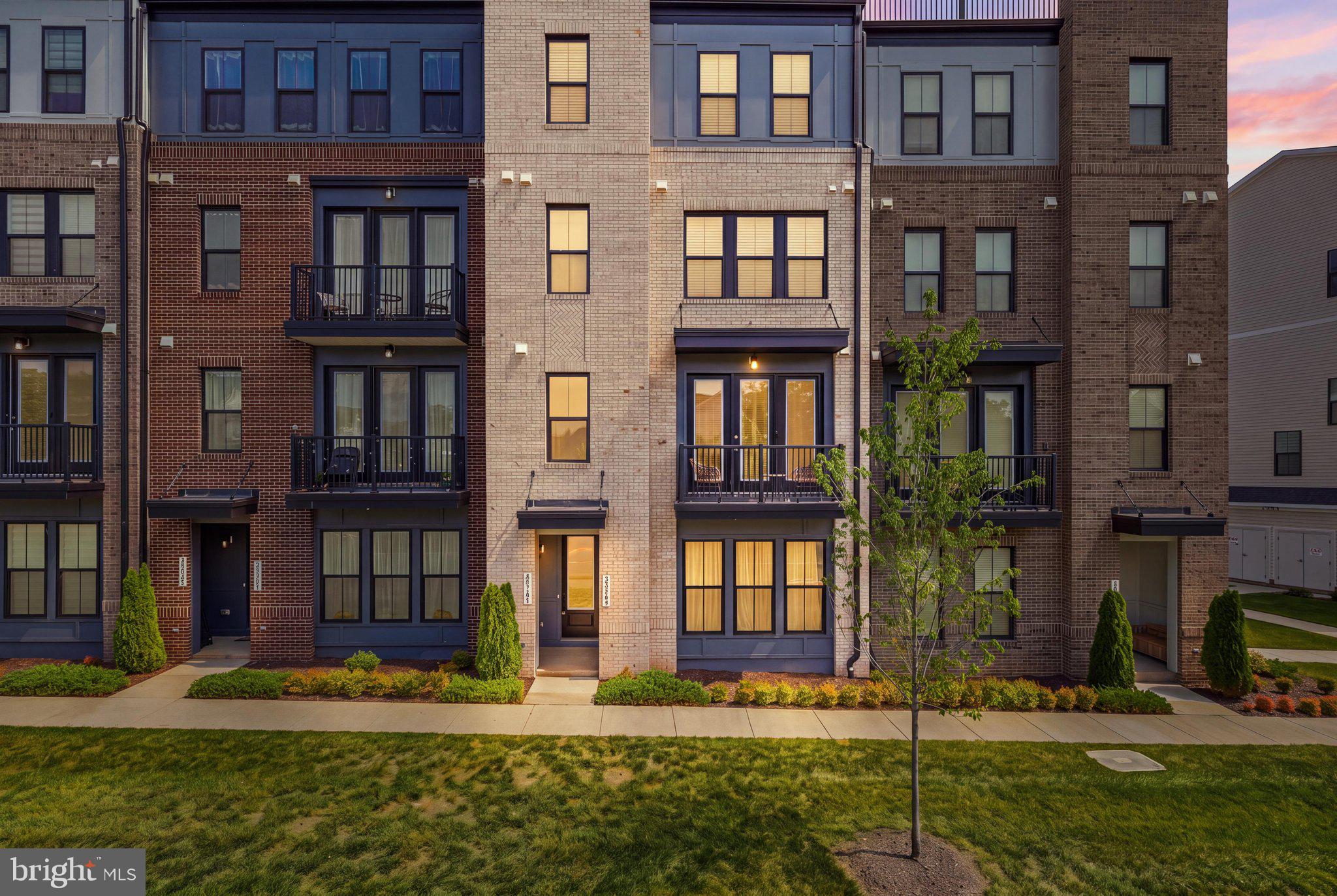 ROOFTOP TERRACE LIVING IN BROADLANDS! Welcome to 43342 Farringdon Sq, a spacious Prescott II townhome-style condo by Van Metre Homes in the highly sought-after Demott & Silver community. Offering 2,544 finished sq. ft. across four beautifully designed levels, this home features 3 bedrooms, 2.5 baths, a 1-car garage, balcony, and private custom rooftop terrace.  The light-filled main level features an upgraded kitchen with stylish white cabinetry, quartz countertops, stainless steel appliances, and luxury vinyl plank flooring. The open-concept kitchen, dining, and great room create an ideal space for everyday living and entertaining, with direct access to the balcony.  Upstairs, the spacious primary suite offers a walk-in closet and luxurious en-suite bath with dual vanities and a large frameless glass shower with built-in seating. Two additional very large bedrooms provide flexibility for guests, a home office, or other needs. The top-level rooftop terrace is the showstopper—an exceptional outdoor retreat perfect for entertaining, relaxing, or enjoying sunset views. The entry level includes a generous foyer, mudroom, and garage access.  Enjoy the best of both worlds: the space and feel of a townhome with the low-maintenance lifestyle of a condominium. Located within the award-winning Broadlands master plan, Demott & Silver offers easy walkable access to the Silver Line Metro's Ashburn Station, Southern Walk shops and restaurants, 3 pools, dozens of parks, and miles of walking and biking trails, with major commuter routes and everyday conveniences nearby.  TOP RATED A+ Briar Woods High School Pyramid!