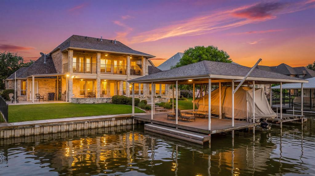 Welcome to 2707 Harborside Drive, an exceptional waterfront opportunity in Granbury's highly sought-after Harbor Lakes community. Perfectly positioned to embrace the Lake Granbury lifestyle, this beautifully maintained home offers luxury, comfort, and incredible amenities both inside and out. Designed for effortless living and entertaining, the home features spacious living areas, abundant natural light, and a thoughtfully designed floor plan that seamlessly connects the kitchen, dining, and living spaces. The home has a second primary bedroom or guest room with an ensuite bath and access to the back patio.Whether hosting family gatherings or enjoying a quiet evening at home, you'll appreciate the inviting atmosphere and functional design. The ultimate entertainment space awaits upstairs with plenty of room to gather, play, and unwind. Step outside and discover one of the property's most impressive features: an oversized private boat dock complete with multiple jet ski space, providing ample room for all your watercraft and lake toys. Spend your days boating, fishing, paddle boarding, or simply enjoying the stunning waterfront setting right from your backyard. Adding even more value, the sale includes a 2001 Sea Ray 240 Sundeck Boat with Custom Covers, televisions, and dining set, making this a truly turnkey opportunity for buyers looking to immediately enjoy everything Lake Granbury has to offer. Located in the prestigious Harbor Lakes community, residents enjoy proximity to Harbor Lakes Golf Club, shopping, dining, medical facilities, and the historic Granbury Square. Whether you're seeking a full-time residence, vacation home, or waterfront retreat, this property delivers the perfect combination of lake living, recreation, and convenience.Experience the best of Lake Granbury living at 2707 Harborside Drive, where everyday feels like a vacation.