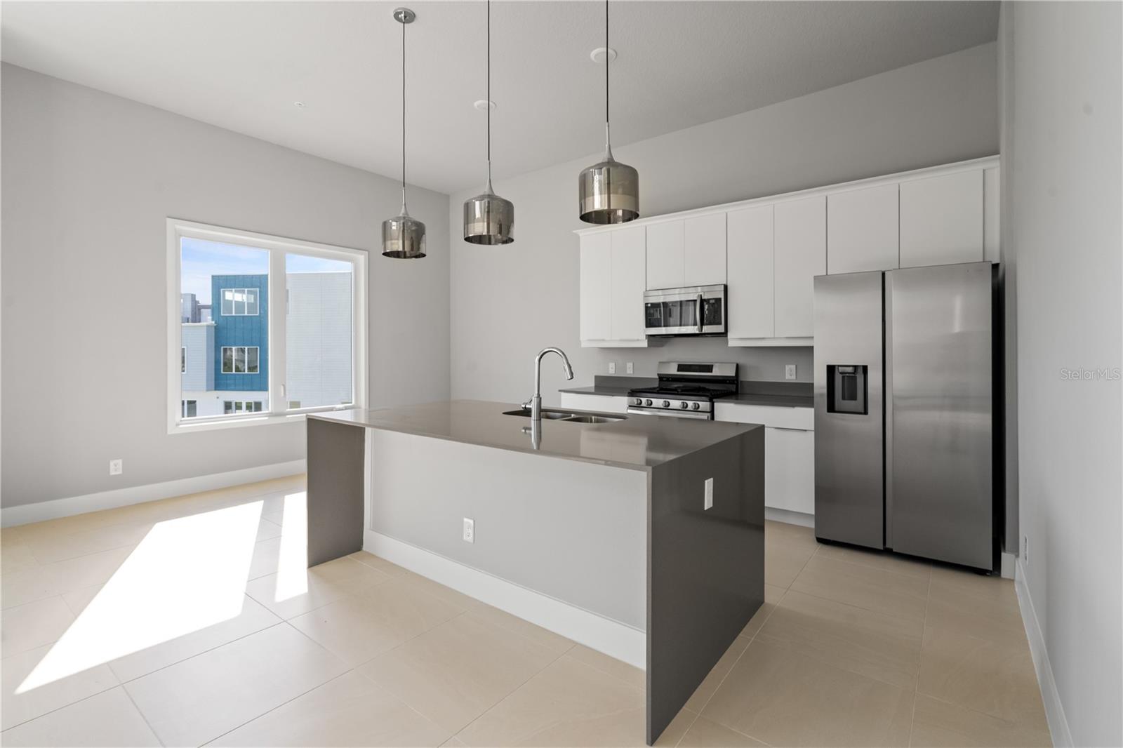 Welcome  to this stunning 2023-built condo in the highly sought-after Reunion Resort! offering 5 bedrooms, 4.5 baths. This home features an open floor plan, soaring ceilings, quartz countertops, stainless steel appliances, and expansive windows flooding the space with natural light. The private rooftop terrace is perfect for entertaining. Reunion Resort offers world-class amenities including water parks with 14 pools, 3 PGA golf courses, a rooftop restaurant, tennis courts, and more. Priced below  market value, this is a rare opportunity to own a true diamond property in one of Central's premier resort communities. Don't miss it!!