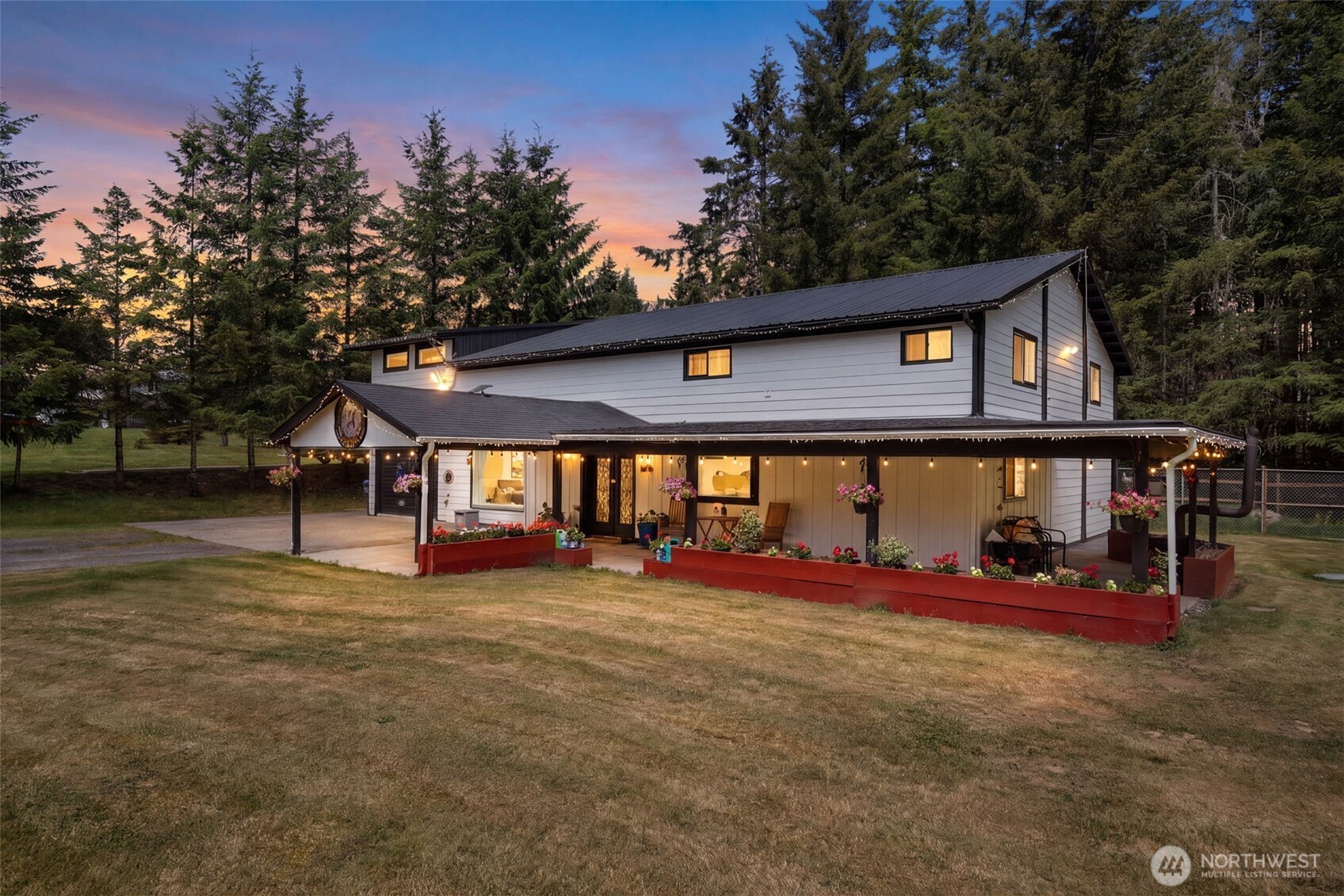 Experience the perfect blend of luxury, functionality, and country tranquility in this exceptional 3,100+ sq. ft. barndominium situated on 4 peaceful acres. Thoughtfully designed with soaring ceilings, exposed beams, and high-end finishes throughout, this impeccably maintained home offers 4 spacious bedrooms, 3.5 bathrooms, and a flexible floor plan to fit a variety of lifestyles. The stunning chef's kitchen showcases beautiful quartzite countertops, premium finishes, and generous gathering spaces ideal for entertaining. A large main-level office with an adjoining bathroom suite offers the potential for a primary bedroom, guest quarters, or private workspace.    Modern conveniences abound, including smart lighting, advanced heating systems, an electric dumbwaiter, and an EV charging station. Outside, enjoy the serenity of rural living with ample space for a hobby farm, gardens, or outdoor recreation. An additional detached building provides endless possibilities as a future ADU, home office, art studio, workshop, or multi-generational living space. Located just minutes from town amenities, shopping, and commuter routes, this remarkable property offers the best of both worlds—peaceful country living without sacrificing convenience.