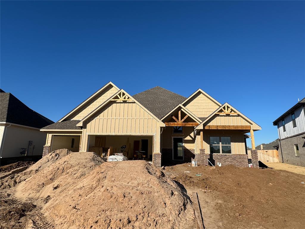 This Wesley Bonus Room floor plan includes 3,630 Sqft of total living space, which features 3,285 Sqft of indoor living space and 345 Sqft of outdoor living space. There is also a 590 Sqft, three-car garage with an in-ground storm shelter installed! This desirable home offers 5 bedrooms, 3 full bathrooms, covered patios, a large bonus room, a powder room, and a utility room featuring a utility sink. The great room supports an immaculate cathedral ceiling with a crows feet detail and a ceiling fan, a luxurious 3-panel sliding door with a 4’ back patio extension, wood-look tile, rocker switches throughout, Cat6 wiring, eggshell paint, and a center gas fireplace surrounded by our exquisite stacked stone detail. The upscale kitchen boasts stunning pendant lighting, stainless steel appliances including double ovens and a 5-burner cooktop, 3 CM countertops, vogue tile backsplash, well-crafted cabinets to the ceiling with cabinet hardware throughout and under cabinet lighting, decorative end panels, a separate walk-in pantry, and a large center island that holds a roomy sink, a dishwasher, and a trash can pullout. The primary suite provides a sloped ceiling detail, a ceiling fan, a plush carpet finish, and windows. Attached is the main bath, which has a bat-winged vanity with framed mirrors, 3 CM countertops, a large European walk-in shower, a private water closet with an elongated toilet, a free-standing tub, and a HUGE walk-in closet! The covered outdoor living area welcomes a wood-burning fireplace, a gas line for your grill, and a handy TV hookup. Other included features for this elegant home include our healthy home technology, an air filtration system, a tankless water heater, double glazed vinyl low E windows with argon, R-44 and R-15 insulation, a fresh air ventilation system, and so much more!