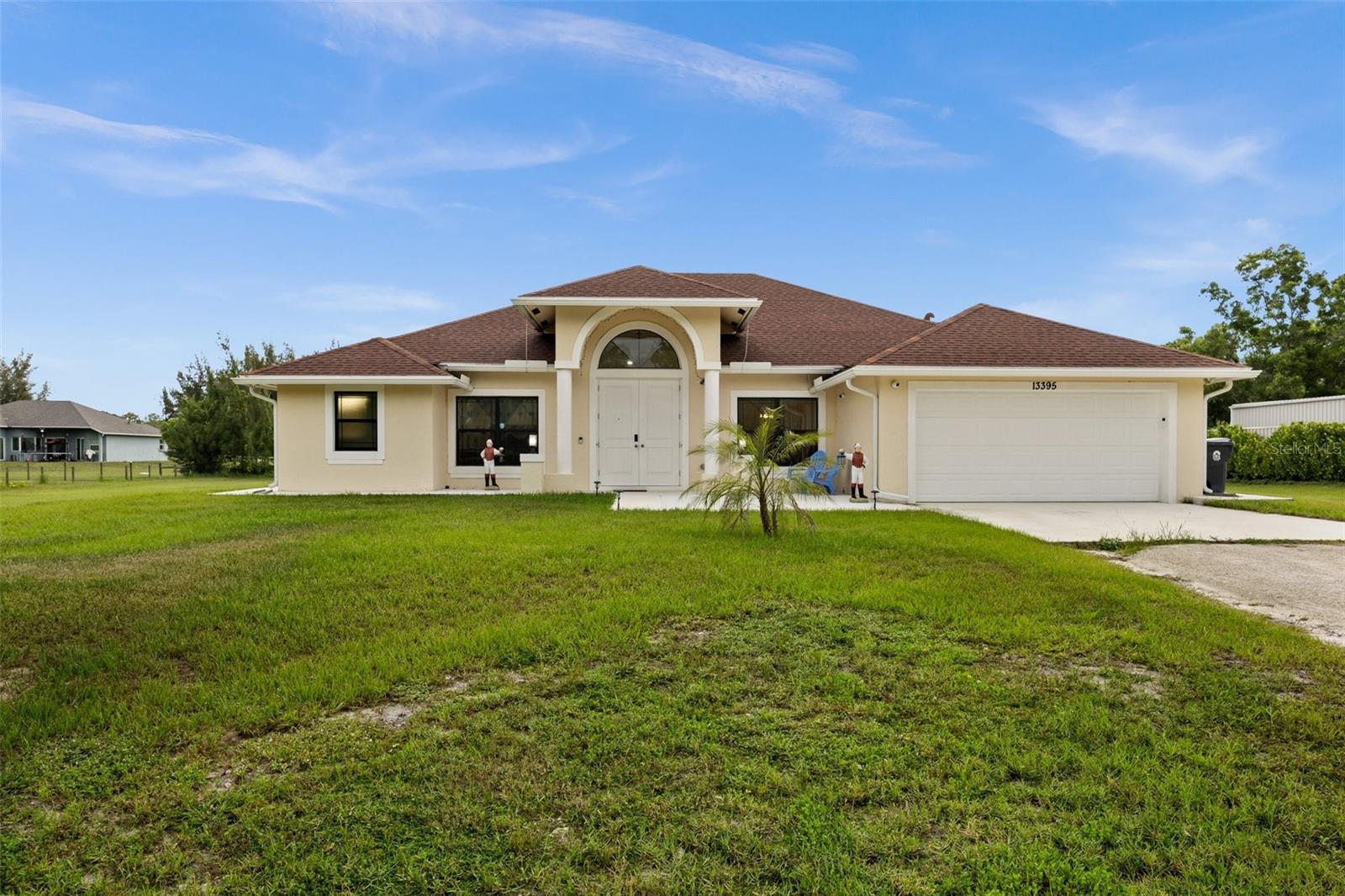 PARADISE FOUND in The Acreage – 2023 Built WILDFLOWER Model! Welcome to 13395 59th Ct N – a rare gem offering the perfect blend of modern luxury, space, and freedom on a sprawling 1.15-acre lot with NO HOA. This impeccably maintained 3-bedroom plus den, 2-bathroom home features the highly sought-after Wildflower floor plan and shows like a model. With impact windows and doors, a fully foam-insulated roof, vaulted ceilings, and an oversized 2-car garage with extra storage, this home is as efficient and secure as it is beautiful.

Step inside to an open-concept layout filled with natural light, neutral tones, and soaring ceilings. The custom two-tone shaker-style kitchen offers premium stainless steel appliances and flows seamlessly into the dining and living areas, creating the ideal space for entertaining and everyday living. The spacious den offers the flexibility to easily convert into a fourth bedroom if needed.

The primary suite is a peaceful retreat, featuring dual vanities, a spa-like soaking tub, a walk-in shower, and an expansive walk-in closet. The large screened-in Florida Room is perfect for enjoying morning coffee or evening breezes while overlooking your private acreage paradise. The expansive lot is ideal for adding a pool, guest house, boat or RV storage, or simply enjoying open space and nature.

Built in 2023, this home includes an LG washer and dryer, all-impact doors and windows for peace of mind, and a fully foam-insulated roof for maximum energy efficiency. The oversized garage provides ample storage for all your tools and toys.

Located just off Royal Palm Beach Boulevard and close to the 441 extension, this home offers the perfect balance of quiet, rural living with convenient access to shopping, dining, schools, and major roadways. The Acreage community is known for its large lots, equestrian-friendly vibe, and welcoming atmosphere, offering a unique blend of privacy and suburban convenience.

This is a rare opportunity to own a like-new home with no HOA restrictions, tons of space, and endless potential. Schedule your private showing today before it’s gone!