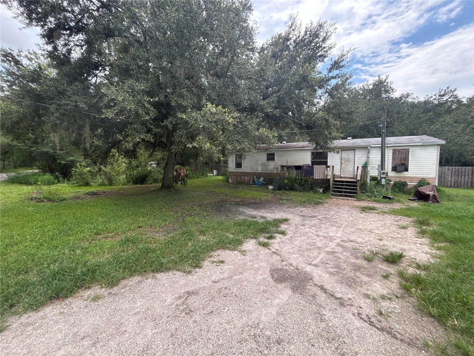 Investor Alert! Incredible opportunity on 1.38 acres in Plant City. This 3 bedroom, 2 bath home offers 1,296 square feet on a spacious 60,113 square foot lot with no HOA. Well pump is 2 years old, and septic was inspected within the last 3 years, giving you a solid foundation to build on. Renovate and resell, or explore the potential to place a new manufactured home on this lot. Quiet, spacious setting with room to grow. Property sold strictly as is. A rare find at this price point.
