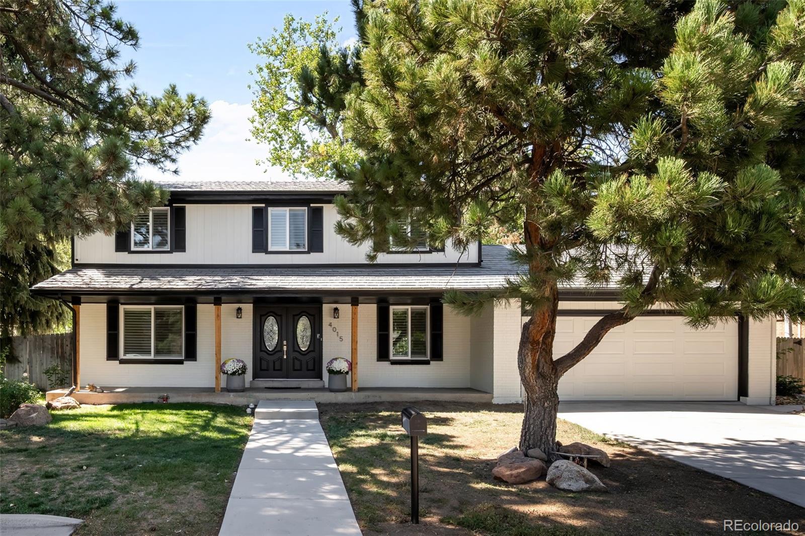 A rare offering in southeast Denver, this impressive residence combines timeless character, exceptional scale, and beautifully designed spaces for elevated entertaining and everyday living. Set on a generous .25-acre lot framed by mature trees and established landscaping, the property enjoys a beautiful setting that complements the home’s substantial proportions. Inside, abundant natural light, plantation shutters throughout, and an inviting flow create a sophisticated yet comfortable atmosphere. The main level features expansive living and gathering spaces along with a versatile bedroom that is equally well suited for guests or as an executive home office. At the heart of the home, the kitchen offers generous cabinetry and workspace with a natural connection to the surrounding living and dining areas. Upstairs, three spacious secondary bedrooms accompany the impressive primary suite, providing exceptional room for family and guests. The finished basement adds another dimension to the home with an additional bedroom and generous recreation and entertaining spaces ideal for a media room, game room, fitness area, or guest retreat. Outside, the beautifully established quarter-acre lot provides an exceptional backdrop for outdoor living, with mature landscaping and plenty of room for dining, entertaining, play, and quiet evenings beneath the trees. A two-car garage and abundant storage complete the home. Ideally positioned in southeast Denver near the Denver Tech Center, with convenient access to shopping, dining, parks, trails, and I-25, this exceptional property brings together substantial living space, a beautiful setting, and an outstanding Denver location.