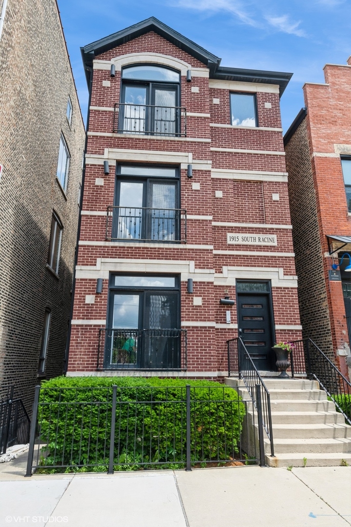 Bright and beautifully updated 2 bed, 2 bath condo in a prime Pilsen location!  Gleaming hardwood floors and soaring 9-foot ceilings welcome you into this move-in-ready home with an inviting open floor plan. The light-filled living area features a Juliet balcony and a cozy gas fireplace, creating the perfect space to relax or entertain.    The updated kitchen offers crisp blue and white cabinetry, stainless steel appliances, granite countertops, a pantry, and plenty of space to add an island if desired. A separate dining area adjacent to the kitchen provides an ideal spot for meals and gatherings.    The spacious primary suite boasts a gorgeous stand up shower , a sleek vanity with a granite countertop, and direct access to a private covered balcony - an ideal spot for morning coffee or evening relaxation. The second bedroom is conveniently located across the hall from the second full bathroom, making it ideal for guests or a home office.    Additional highlights include excellent closet space throughout, in-unit washer and dryer, an exterior parking space, and a dedicated storage unit. This well-maintained building offers low taxes, low assessments, and a location just one block from the restaurants, bars, and shops of 18th Street.  New HVAC (2020), Renovated Kitchen and Baths (2023). New Roof summer of 2025 (Paid For by Seller)    A beautiful home in the heart of trendy Pilsen - don't miss this true gem!