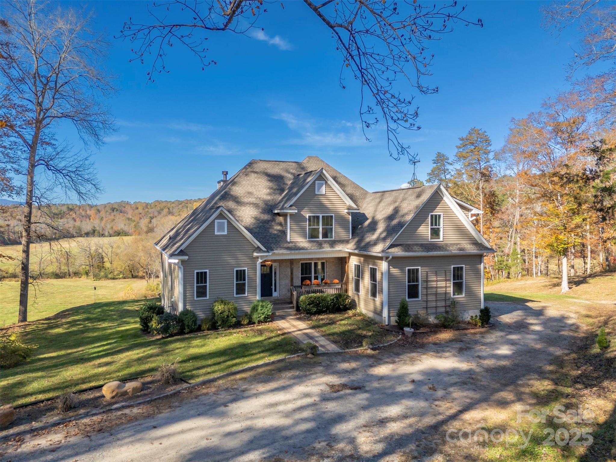 A rare Polk County property combining river frontage, equestrian potential, and near-zero energy costs in a serene, turnkey, mountain view estate setting. Experience modern comfort, energy independence, and natural beauty on this 38-acre Green River estate. Built in 2019, this 4 BR / 3.5 BA custom home features dual primary suites (main & upper), open living spaces with wood floors and a granite hearth fireplace with mantle of hickory cut and milled on the property. The granite kitchen with Induction range enjoys a big walk-in pantry with sink and prep counter. A full basement is plumbed & framed for finishing, with wall of windows to enjoy the outdoors. Enjoy nearly 1,000 ft of river frontage with a natural rapids, and five-to-six acres of river-meadow suitable for horse pasture. Morton-built barn, 30×42 workshop, and equipment garage provide outstanding functionality. A 72-panel solar array with Generac battery storage powers both house—recent REMC bills average under $60/month total, including barn on a separate meter. Wide trails wind throughout the wooded acreage, ideal for riding or ATVs. Skyrunner internet & DISH TV deliver reliable service. Private easement driveway ensures seclusion just minutes from Tryon, Columbus, and Lake Adger. Spectrum just recently installed fiber optic cable up the driveway, and promises to connect it to house by February for ultimate connectivity.