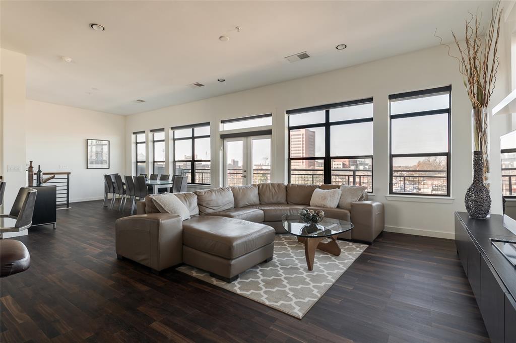 Luxury Penthouse Condo with Campus Views!  Rare opportunity to own a penthouse condo at the highly desirable 401 Lofts in Norman. This upgraded 2 bed, 2.5 bath, 1,685 sq ft residence offers the perfect blend of modern finishes, lock-and-leave convenience, and unbeatable proximity to OU campus, Campus Corner, and game-day energy. Enjoy premium custom upgrades throughout, including dark wood flooring, a striking art wall, glass-top island range, and sleek stainless range hood. The open kitchen and living area flow seamlessly to a private corner balcony – so close to the stadium you can hear the crowd cheer. Both bedrooms are located downstairs and feature en-suite bathrooms, walk-in closets, new carpet, and views overlooking the pool and OU campus. The primary suite includes an oversized soaking tub, while an additional powder bath on the second floor adds convenience for entertaining. Additional upgrades include custom solar shades, a built-in desk nook, a custom home office in the guest bedroom, fresh interior paint, and Ecobee smart thermostats. A high-capacity 80-gallon electric water heater enhances everyday comfort. Community amenities include a pool, firepit lounge, BBQ grill, and onsite fitness center. This unit also includes two dedicated parking spaces in the gated garage plus a private indoor storage unit—a rare find near campus. Perfect as a luxury primary residence, game-day retreat, or low-maintenance investment property, this penthouse delivers the location, upgrades, and lifestyle buyers search for in Norman. Don’t miss your chance to own one of the most desirable units at 401 Lofts – penthouse living with campus views and unmatched convenience.