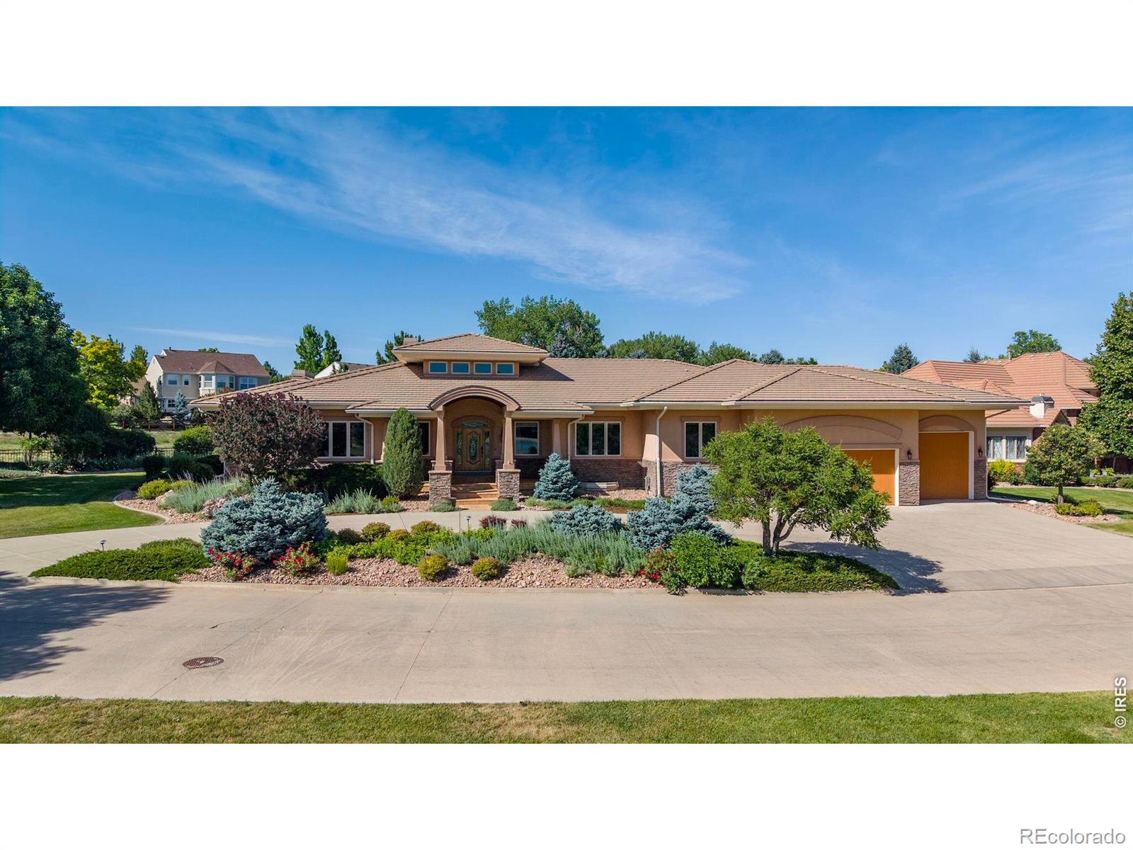 OPEN SAT 1-3 PM! Meticulously maintained by the original owners, this exceptional custom ranch-style home is perfectly situated on a premier .60 ACRE lot backing to walking trails & overlooking Eagle Trace Golf Course. Combining timeless design, quality craftsmanship, and spacious living, this remarkable home offers both luxury & comfort in one of Broomfield's most sought-after neighborhoods. A circular driveway & grand 2-story entry create a memorable first impression, showcasing custom woodwork & exceptional attention to detail thru-out. The expansive main level features 4,135 SQFT of living space with soaring ceilings & generously sized rooms designed for both everyday living & entertaining. The gourmet kitchen is equipped with high-end appliances, slab granite counters, large breakfast bar, walk-in pantry, and breakfast nook. It opens to the spacious living room, creating the ideal gathering space for family & guests. Step outside to the covered patio with outdoor kitchen & beautifully landscaped backyard. The luxurious primary suite serves as a private retreat, featuring a gas fireplace with custom stone surround, 5-piece bath & large walk-in closet w/ custom organization system. Two additional main-level bedrooms have their own ensuite baths providing privacy for family or guests. The finished lower level expands the living space with a large family room, wet bar, fireplace, exercise room & spacious guest suite w/ ensuite bath. An expansive unfinished area provides abundant storage or expansion opportunities. The oversized, climate-controlled 3-car garage is as immaculate as the home itself, featuring epoxy flooring, utility sink & direct access to a lower-level workshop space. An oversized garage door offers storage for your RV, Boat, Sprinter or Airstream. Located in the highly desirable Broomfield Country Club community, residents enjoy convenient access to golf, parks, trails, top-rated schools, shopping, dining & easy access to Denver/Boulder.