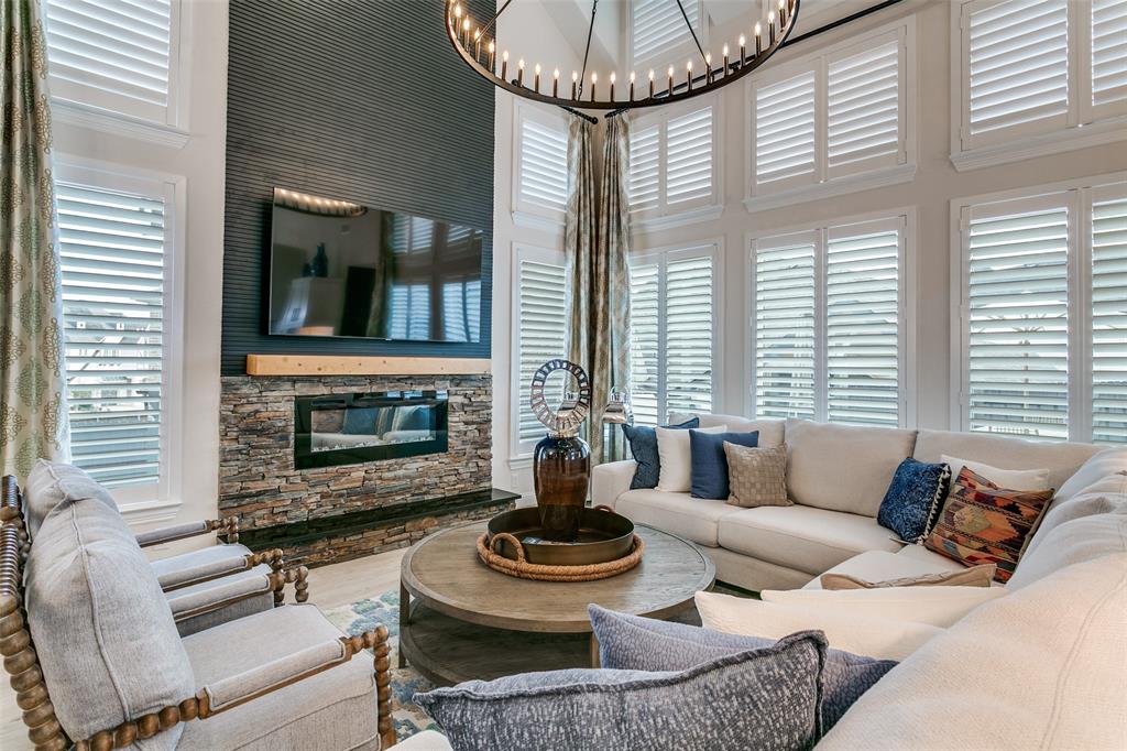 Welcome to 2411 Perdue Ave, a stylish east-facing home built in 2024 in the newly constructed Grand Braniff community. With over $300,000 in thoughtful customization and upgrades, this residence offers elevated finishes and a layout designed for modern living. The heart of the home is the expansive kitchen and main living area, highlighted by soaring ceilings and an open feel that immediately makes an impression. Natural light fills the space, and the oversized island creates the perfect gathering spot for entertaining or everyday life. The kitchen offers abundant cabinetry, generous prep space, and seamless flow into the living area, making the space both functional and inviting. The primary suite is privately located on the main level and provides a calm, comfortable retreat. The bathroom features dual vanities, a large walk-in shower, and ample storage. Also downstairs is a second bedroom with a full bath, ideal for parents or extended guests A separate secondary living space on the main floor adds flexibility and can serve as a sitting room, playroom, game room, or workspace. Upstairs, generously sized bedrooms are complemented by an additional living area. The expansive backyard and deck extend the living space outdoors, creating the perfect setting for morning coffee or relaxed evenings at home. Located approximately 3 miles from Las Colinas, including Toyota Music Factory, Lake Carolyn, golf clubs, and about 12 miles from Downtown Dallas, the location makes either commute a breeze while still offering the comfort of a residential neighborhood