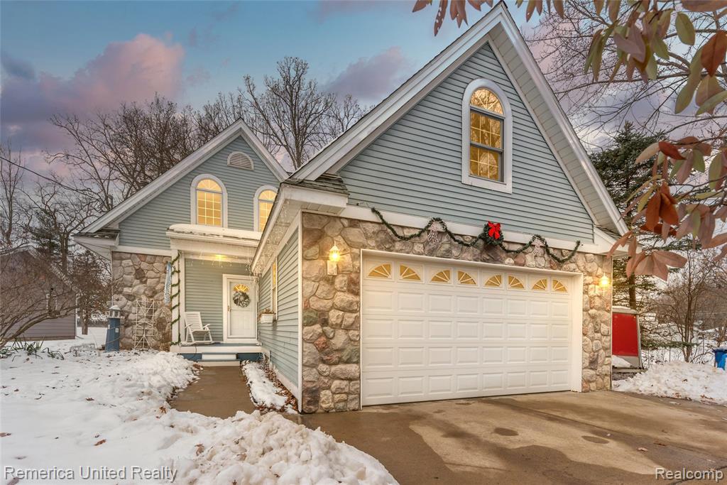 Experience lakefront living at it’s finest on all-sports Round Lake in Hartland. Set on a gorgeous lot with pristine, panoramic water views, this 3-bedroom, 2.5-bath home offers the lifestyle of an Up North retreat—without the drive!  This home has been updated throughout the years and features new luxury vinyl plank flooring throughout, ideal for waterfront living, a thoughtfully designed floor plan and plenty of storage. The kitchen offers abundant cabinet space and a walk-in pantry, perfect for entertaining and everyday use. The living room is highlighted by a cozy stone fireplace and expansive windows that frame stunning lake views.  Main-level living is enhanced by a spacious first-floor bedroom with breathtaking views of Round Lake, a full bath, and convenient first-floor laundry. Upstairs, you’ll find two oversized bedrooms with vaulted ceilings and large windows that flood the space with natural light, along with a Jack-and-Jill full bath and an additional half bath.  Outdoors, enjoy a shallow sandy beach, included dock, and endless opportunities for boating, swimming, and relaxation. A storage shed provides space for lake toys, while the 2-car attached garage includes an unfinished bonus room above—ideal for extra storage or easily finished for additional living space.  Vacation at home year-round while enjoying the convenience of nearby shopping, dining, and easy access to expressways. Property across the lake is in a nature conservancy.