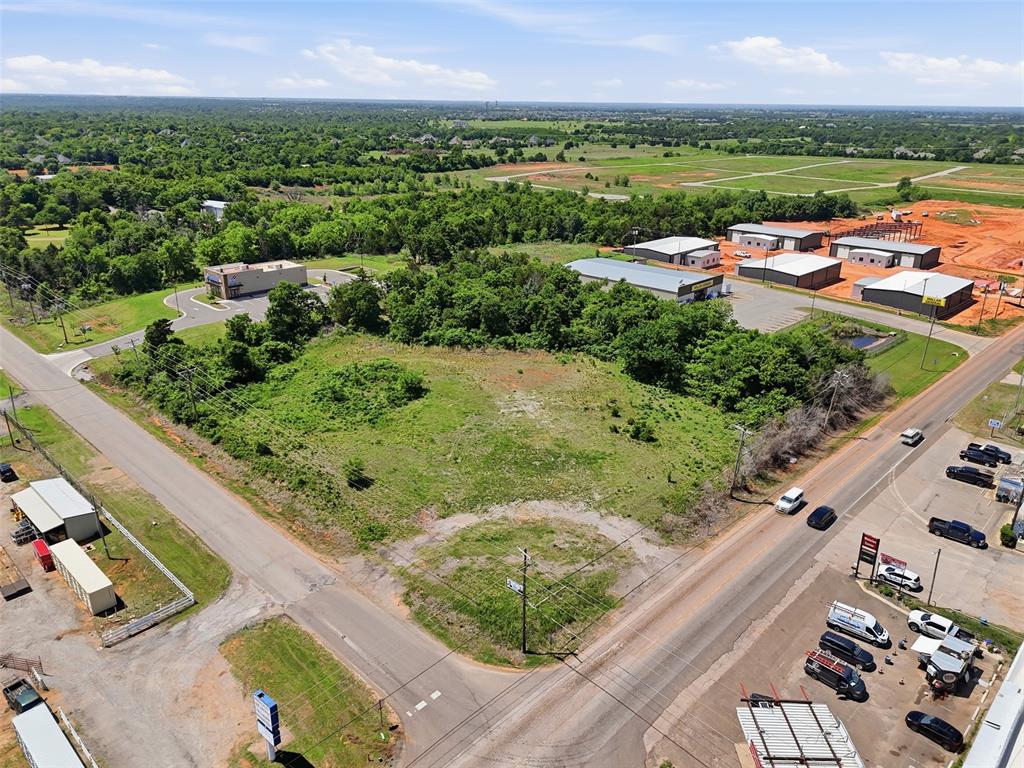 A true commercial corner positioned inside active daily traffic, not future speculation.This 3+ acre commercial site sits on the southwest corner of Waterloo Road and Coltrane Road, surrounded by established businesses, service retail, fuel, and neighborhood-serving commerce. The intersection already functions as a daily stop for local traffic, creating built-in visibility and demand.The property offers strong frontage along Waterloo, excellent sightlines from both directions, and a gentle natural rise that provides ideal pad placement, drainage, and signage visibility without excessive site work. Interior topography is open and flexible, allowing for multiple layout concepts including pad development, single-user retail, or service-oriented commercial uses.Utilities and infrastructure are present throughout the corridor, and nearby development activity confirms continued growth moving north through Edmond. With proximity to I-35 and an established commercial environment already in place, this site is well-suited for users or investors looking to secure a corner before the next phase of development.This is a buy-it-right, build-smart, or hold-strategically opportunity in one of Edmond’s actively evolving commercial corridors.