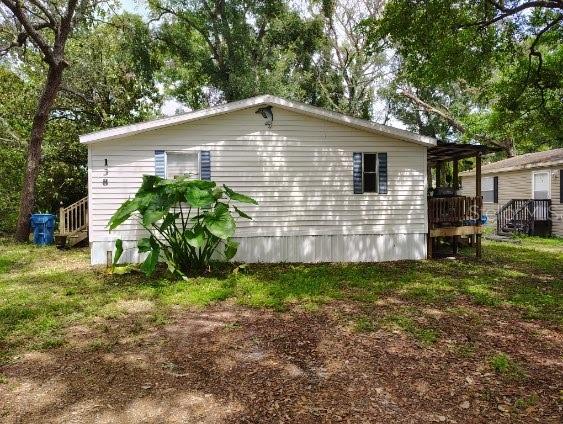 Secluded Retreat – Updated 3/2 Mobile Home with Total Privacy! 
Welcome to your private oasis! Nestled on a quiet, secluded street, this beautifully updated 3-bedroom, 2-bathroom mobile home offers the perfect blend of comfort and tranquility. Recent updates include a new roof and heat/air system in 2021,Septic and engineer inspected 2024  giving you peace of mind and energy efficiency for years to come.

Inside, you'll find a bright and inviting layout with stylish finishes and a thoughtfully refreshed interior. Step outside and enjoy your mornings surrounded by mature trees—no neighbors in sight, just you and nature.

Despite its peaceful setting, you're just minutes from major highways, shopping, dining, and entertainment. Plus, enjoy easy access to both Tampa and Orlando, making day trips and weekend getaways a breeze.


Whether you're looking for a full-time residence or a serene seasonal escape, this hidden gem delivers the privacy you crave and the upgrades you need.