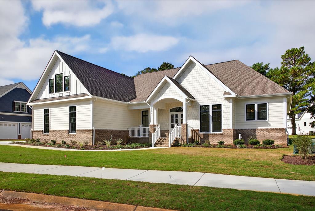 Discover elegant coastal living in The Peninsula, an exciting new home in The Signature by Ruiz Homes. Gracious double front doors take you into the foyer which flows seamlessly into a dining area and large family room with fireplace. This space adjoins the gourmet kitchen with center island, spacious pantry, and second dining area that opens onto a covered back porch. The first level has two guest bedrooms, each with a full bath, as well as the owner's suite with two separate walk-in closets and a bathroom with tub and separate shower. On the upper level, a bedroom and full bath are joined by a vast 418+ sq ft flex space—perfect for a home office, guest suite or game/media room. Oversized 2-car garage with plenty of room for storage.  SELLER TO PAY $25,000 TOWARDS CLUB JOINING FEE.