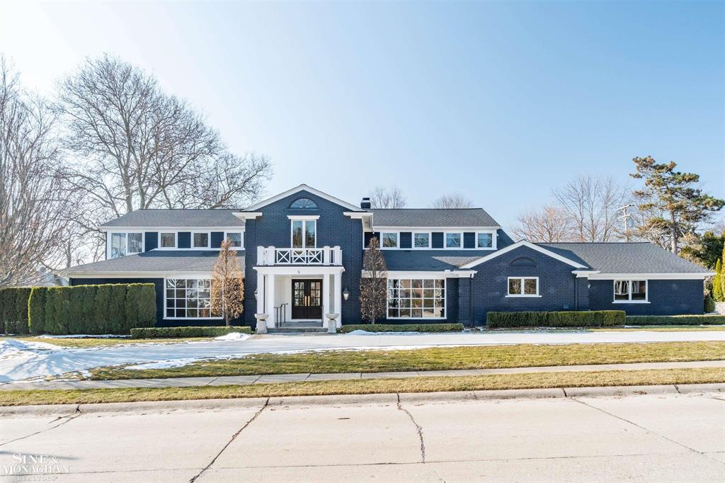 This exceptional Lake St. Clair estate offers panoramic waterfront views from nearly every room. Extensively renovated in 2019, this sophisticated residence blends timeless elegance with modern comfort, featuring a chef's kitchen &comprehensive updates including roof, furnaces, central air, windows, doors, electric panel 2023,& new concrete drive 2025.The main level offers refined living & dining rooms, a dramatic floating staircase, private library, an open-concept floorplan, a sun-drenched solarium, a luxurious 1st floor primary suite, plus two additional en-suite bedrooms. The second floor features a second primary suite with sweeping lake views, a private office overlooking the water, & a generous bedroom currently configured as a full gym with its own bath. Outdoor living is highlighted by a newly designed lakeside patio and manicured landscaping with unobstructed views. Property includes 2nd vacant lakefront property id: 38 015 03 0012 004. Property is non homestead.