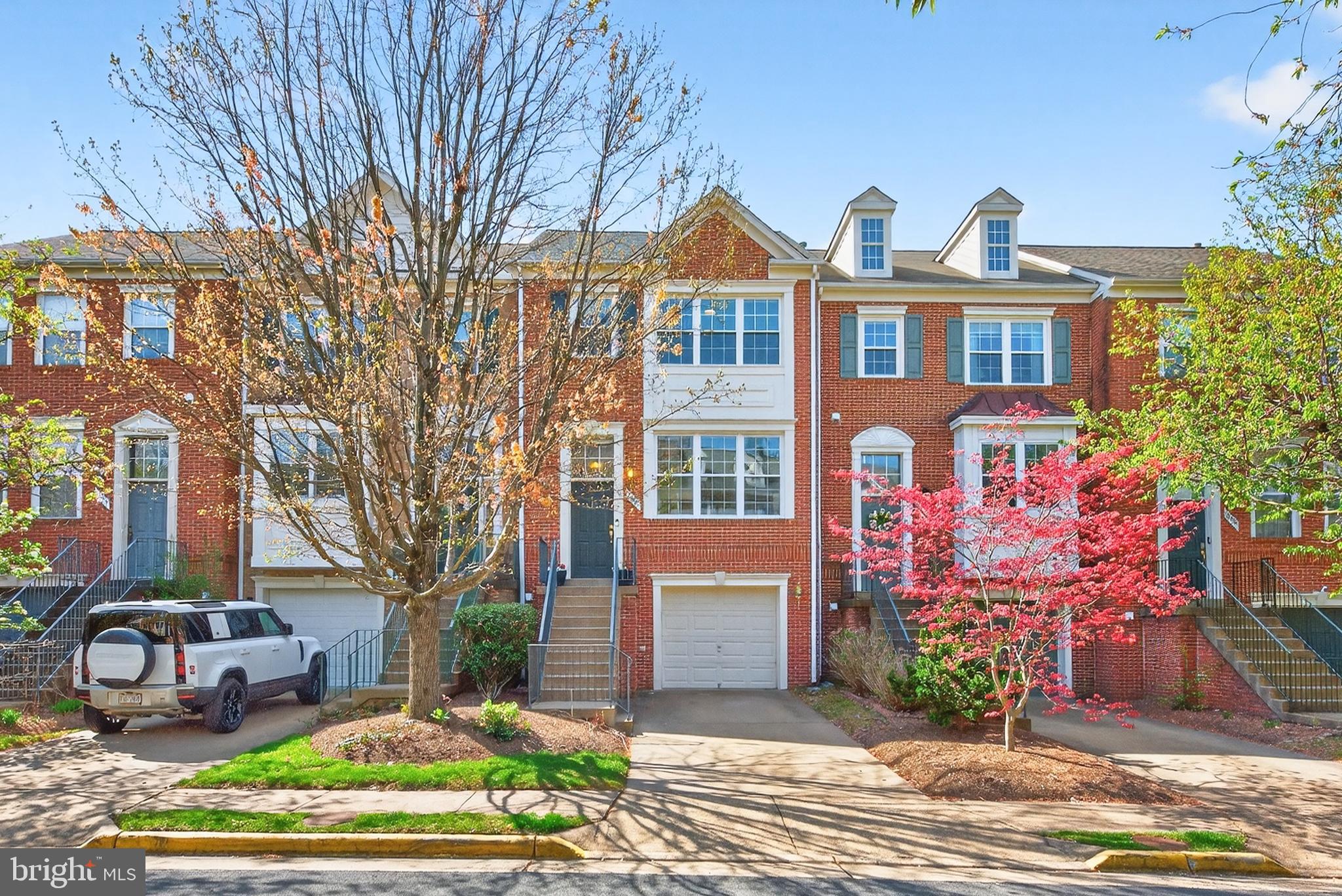 Looking for a garage townhome in a walkable Reston location? This is it. A well-maintained and updated 3-bedroom, 2 full and 2 half bath townhome in a fabulous neighborhood.The main level features cherry hardwood floors throughout, with a bright living room centered around a gas fireplace and a convenient powder room at the front of the home. The kitchen is well-appointed with granite countertops, tile backsplash, stainless steel appliances, and a breakfast area, with a sliding glass door leading to the deck—ideal for everyday living and easy entertaining. The kitchen opens to a cozy family room and a dining area. Upstairs, you’ll find three bedrooms, all with vaulted ceilings, including a spacious primary suite with a walk-in closet and an updated bath featuring a double vanity, separate shower, and soaking tub. The hall bathroom has also been updated, and there is a convenient linen closet in the upper hallway.The lower level offers a walk-out basement with a recreation room, half bathroom, laundry closet, and sliding-glass-door access to a fenced rear yard with a patio. The one car garage enters on this level. Major updates include bathroom renovations (2017), new stove and microwave (2017), HVAC (2018), roof (2019), water heater (2021), and dishwasher (2025).The location is a standout—just minutes to Reston Town Center, Trader Joe’s, and Target, with easy access to the Wiehle–Reston East Metro Station, Reston Hospital Center, and major commuting routes including the Dulles Toll Road and Fairfax County Parkway. Enjoy nearby access to the W&OD Trail, along with community amenities including a pool and fitness center.A solid combination of updates, functional space, and prime location.