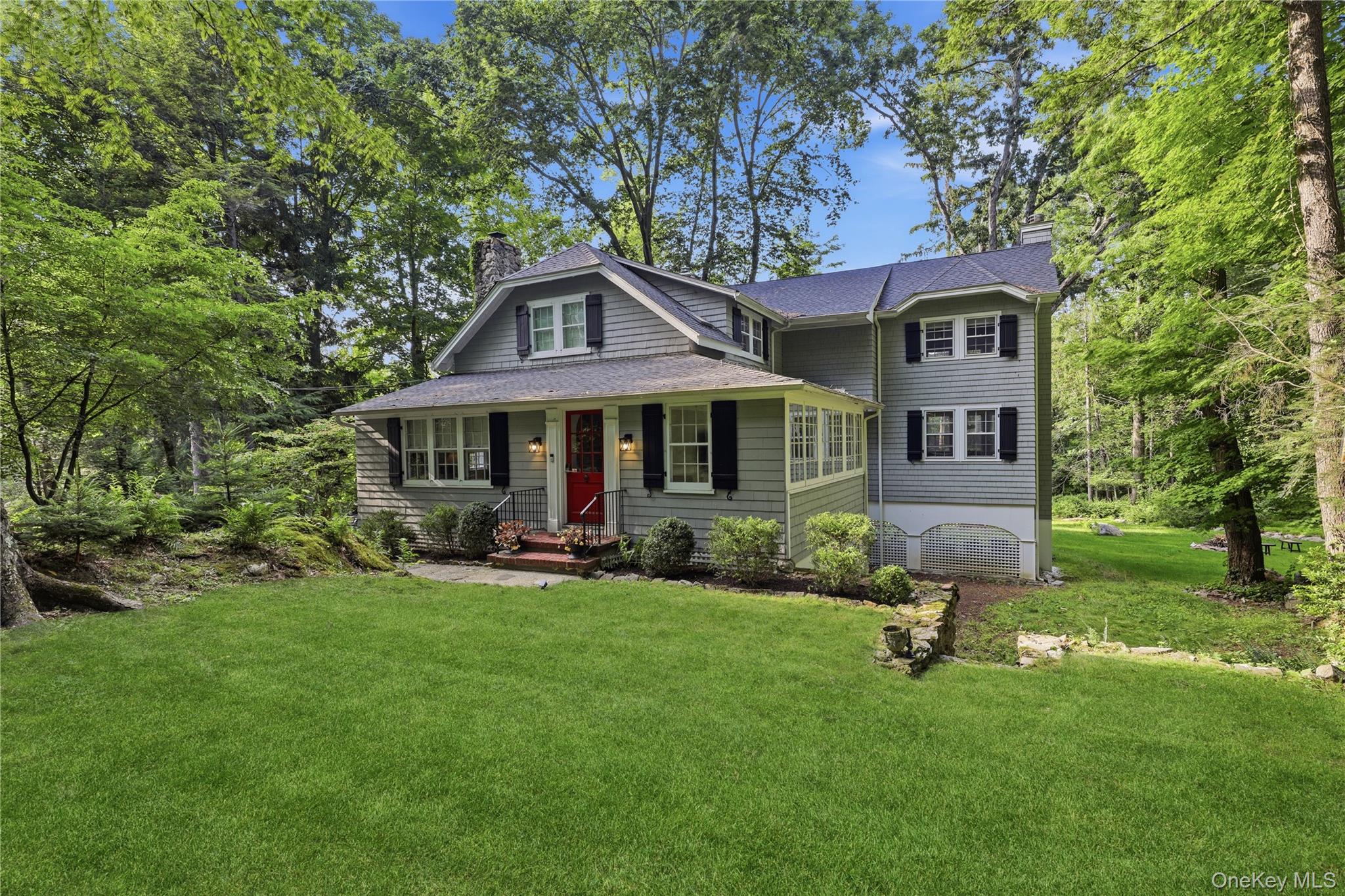 Enter into this enduring Colonial blending elegance with today's lifestyle. This home lives like a 4-bedroom and has 4 BR septic. Set on beautifully landscaped property moments away from town, the train and Chappaqua schools. Tastefully expanded and renovated in 2008, this home showcases classic architectural details everywhere.  A welcoming foyer opens to a gracious living room and fireplace. A formal dining room with a tray ceiling.  Timeless appointed chefs EIK with Wolf appliances, custom cabinetry and marble counter tops, wine refrigerator and breakfast bar. The family room offers a second fireplace and a wall of windows to view the private setting.  The sunroom offers custom built-ins and an abundance of natural light. A first floor study/bedroom and full bathroom works well for guests or an au pair. A mudroom with custom built-ins. Upstairs is the  primary bedroom with high ceilings, walk-in custom closet, private study, and en-suite bath with double sinks, marble shower and whirpool bath.  Two additional bedrooms, one with custom built-ins, custom closets, and a hall bath.  New laundry is located conveniently on the second floor.  Outdoors, an expansive deck extending the living space and creating the  perfect setting for entertaining, dining and relaxing while overlooking  mature landscaping and private grounds that back up to protected green space.   Completing the property is a detached two car-garage with generous storage above.   The home was extensively  renovated and expanded in 2008 offering the finest architectural finishes. An exceptional offering. New roof 2024 and new 4 bedroom septic 2026.