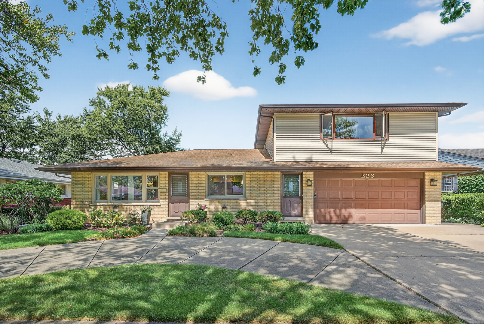Beautiful and meticulously maintained 5-Bed/2.2-Bth bi-level home in wonderful Park Ridge location! This home has space for everyone. As you enter the front door, you're greeted by a large and spacious dining room with lots of natural light and hardwood floors that flow throughout the dining room and kitchen. The huge kitchen features an oversized island with breakfast bar, built-in double ovens, all SS appliances, granite countertops and plenty of cabinet space. Off of the kitchen, you'll find the expansive, light and bright living room. The living room also has sliders that lead out to your patio. On the main floor you'll also find a full bath and 3 comfortable bedrooms, including one with a shared en-suite half bath. Upstairs, you'll find 2 additional extra large bedrooms and a sitting area perfect for a reading nook or home office. The finished basement provides even MORE living space with a large rec room with wet-bar, 2 workshops, lots of storage, a half bath and the laundry area. As an added bonus, the laundry room has a full size fridge for extra food storage! Outside, enjoy your beautiful, private fenced-in yard complete with raised garden beds. Attached 2-car garage with circular driveway. Recent updates include remodeled kitchens & bathrooms in 2019, new water heater 2024 and more. You can't beat his home or it's location - close to parks, groceries, restaurants, sought-after schools and all that downtown Park Ridge has to offer. Schedule your tour today!