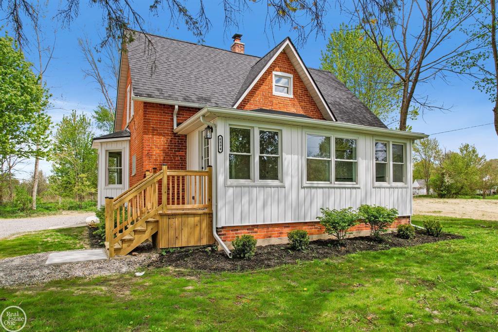Country Paradise.  Escape to your own private retreat with 6+ acres of serene, wooded beauty-perfect for outdoor living, recreation, and year-round adventure. This beautifully updated split-level home blends farmhouse charm with modern finishes, offering comfort, style, and space for every need.  Main Floor Comfort & Style.  Step into a bright, welcoming foyer with refinished hardwood floors flowing through most of the main level. The brand-new kitchen features soft-close shaker cabinets with 42" uppers and crown molding, granite countertops, stainless steel appliances, and recessed lighting. A flexible room off the kitchen can serve as a formal dining area, home office, or playroom. Convenient first-floor laundry and a fully updated half bath add to the functionality.  Private Owner's Suite The spacious primary bedroom offers a large walk-in closet, recessed lighting, ceiling fan, and a stunning new ensuite bath with a dual-sink granite vanity, relaxing clawfoot tub, and tiled shower with surround. Upstairs Retreat.;  The second level features two generous bedrooms, a loft with new carpet, and a newly updated full bath with a dual-sink vanity, granite counter, and subway-tile shower with stone floor. Indoor"“Outdoor Living.  Enjoy the great room's abundant natural light, bay window, and open layout, or step outside to your new cement patio with outdoor fireplace-perfect for summer evenings under the stars. Extra Buildings for Work & Play.  A large barn provides ample workshop space plus a finished bonus room for a home office, hobby space, or guest accommodations. Additional outbuildings are ready to store your outdoor gear, vehicles, or recreational toys. Move-in ready and set for your next adventure-welcome home to the best of country living. Other brand-new updates include: roof, roof sheathing, insulation, furnace and A/C, water heater, septic tank and field, updated electrical, updated plumbing, most windows replaced, vinyl siding, front and side entry stairs and decks.  Large circular drive with new limes