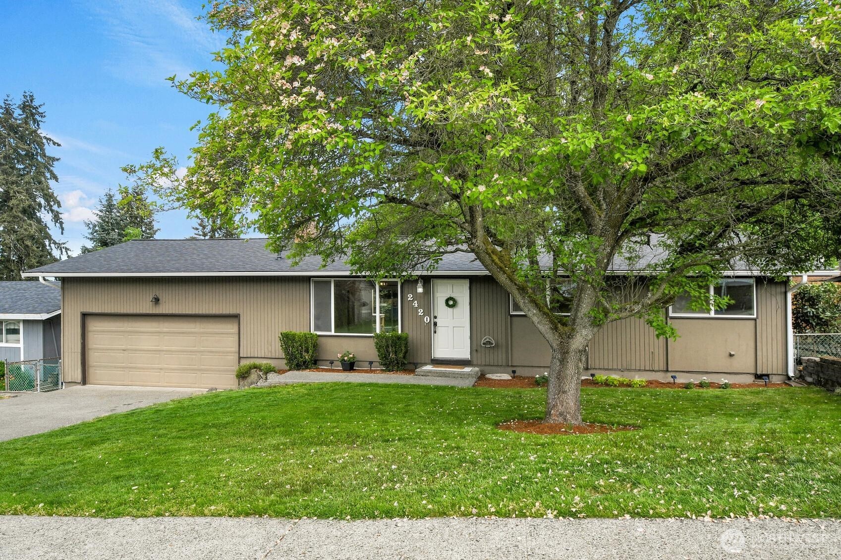 Beautifully maintained rambler on a large, level lot in a quiet West Federal Way neighborhood. This home has been tastefully updated throughout, including a **2023- 30-year roof with transferable warranty**, **hot water tank replaced in2023'**, **new flooring 2025**, and **fresh interior paint**. The updated kitchen features newer appliances and flows into a bright living area anchored by a cozy wood-stove insert for efficient winter warmth. The main bath offers a double vanity and a convenient bath/shower combo. South-facing secondary bedrooms overlook the shaded front yard for peaceful natural light.    Owner-added pantry and powder bath increase everyday function; these finished spaces are not included in the MLS-reported square footage, giving the home a more spacious feel. The three-tiered deck is in excellent condition and provides generous outdoor living and entertaining space. The large backyard includes mature trees, garden areas, a firepit, and an additional gated section with a level pad ideal for projects, play, or creative use. The high-loft garage offers abundant storage along with a built-in workbench. Utility room sits just five steps down and provides additional storage potential.    Ideally located near Celebration Park, Olympic View K-8, Decatur High, shopping, dining, and everyday conveniences. Quick access to Dash Point State Park, nearby bus routes, and the future Federal Way light rail station.