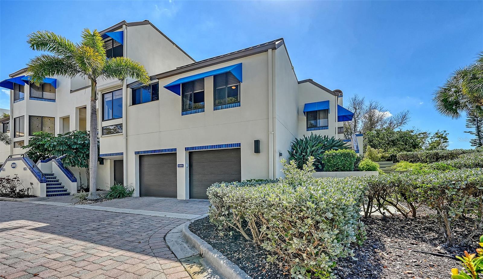 Behind the gates of Bay Isles, a private country club community, lies an immaculate 2-bedroom, 2-bath end-unit townhouse with a side-by-side 2-car garage plus extra space for hobbies or storage. Upgrades abound: LVP flooring throughout, upgraded ceiling fans, a new dining chandelier, under-cabinet lighting, fresh paint, custom wood trim, new shaker cabinets, countertops, and premium appliances. Beyond the home, you’re steps from Longboat Key Club’s golf, tennis, and marina, and near St. Regis Resort. Sarasota’s best awaits: walk to the beach, St. Armands, and Anna Maria. Plus, enjoy fishing, boating, and all the water adventures Sarasota offers!