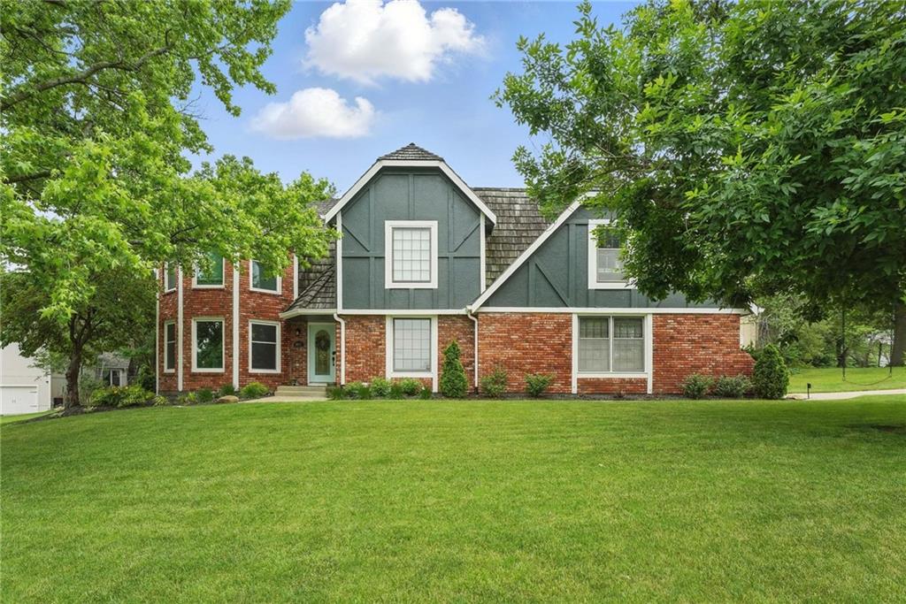 Located in Lakewood—one of Lee’s Summit’s most beloved lake communities known for its natural beauty, fishing, paddle sports, and abundant amenities—this beautifully updated second-tier lake home offers the perfect blend of comfort, function, and style. With 4 spacious bedrooms and 2.5 baths, this home features an open floor plan with generously sized rooms ideal for everyday living and entertaining. The main level boasts rich hardwood floors, while the upstairs offers plush newer carpet for cozy comfort. The show-stopping kitchen is a true chef’s dream—featuring a gorgeous blend of quartzite and granite countertops, stainless steel appliances, and a gas range that deserves a chef’s kiss. The luxurious primary suite is your private retreat, complete with a sitting area and cozy fireplace. The ensuite bath includes a double vanity, jetted tub, and a stunning new tiled shower with elegant gold finishes. A finished lower-level family room is the perfect hangout space for movie nights, game days, or casual entertaining. Step outside to a spacious deck that extends your living area outdoors, where raised garden beds will delight any green thumb. The fenced yard completes this peaceful backyard retreat. Enjoy all the perks of Lakewood living—walking trails, community events, tennis, pools, clubhouse, and, of course, access to the lake! Please note - Sellers willing to replace current shake roof with composite with an acceptable offer.