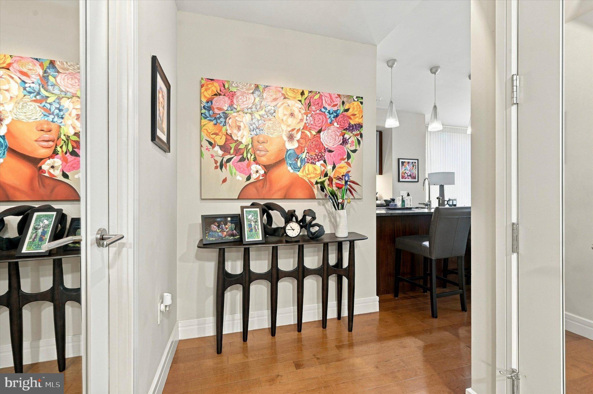 Experience the epitome of luxury living at The Ritz-Carlton Residences, Philadelphia. This exquisite 2-bedroom, 2.5-bathroom home is adorned with wood floors, custom lighting and elegant window treatments, creating a warm and inviting atmosphere. The gourmet kitchen is a chef's dream, featuring gas cooking, Viking built-in microwave, Subzero Refrigerator, Mile dishwasher, U-line Wine storage, and ample pantry space, perfect for culinary enthusiasts. Retreat to the primary suite, complete two customized closets, one of which is a walk-in, a lavish main bath with Calacatta Gold marble, double vanity, Bain soaking tub and frameless glass walk-in shower. The private guest bedroom comes with ensuite bath and customized closet.  Indulge in the legendary Ritz-Carlton services and amenities, including a state-of-the-art 7000 sf fitness center, indoor lap pool, concierge and porter services, resident lounge and media room, outdoor terrace with gas grills, lounge sitting, fire pits, an on-site dog park and a gated garden with waterwall.  One parking space is included with the unit in the on-site, underground valet parking garage. All designed to elevate your living experience. Embrace a life of sophistication and comfort in this exceptional residence, where every detail is crafted for your enjoyment.