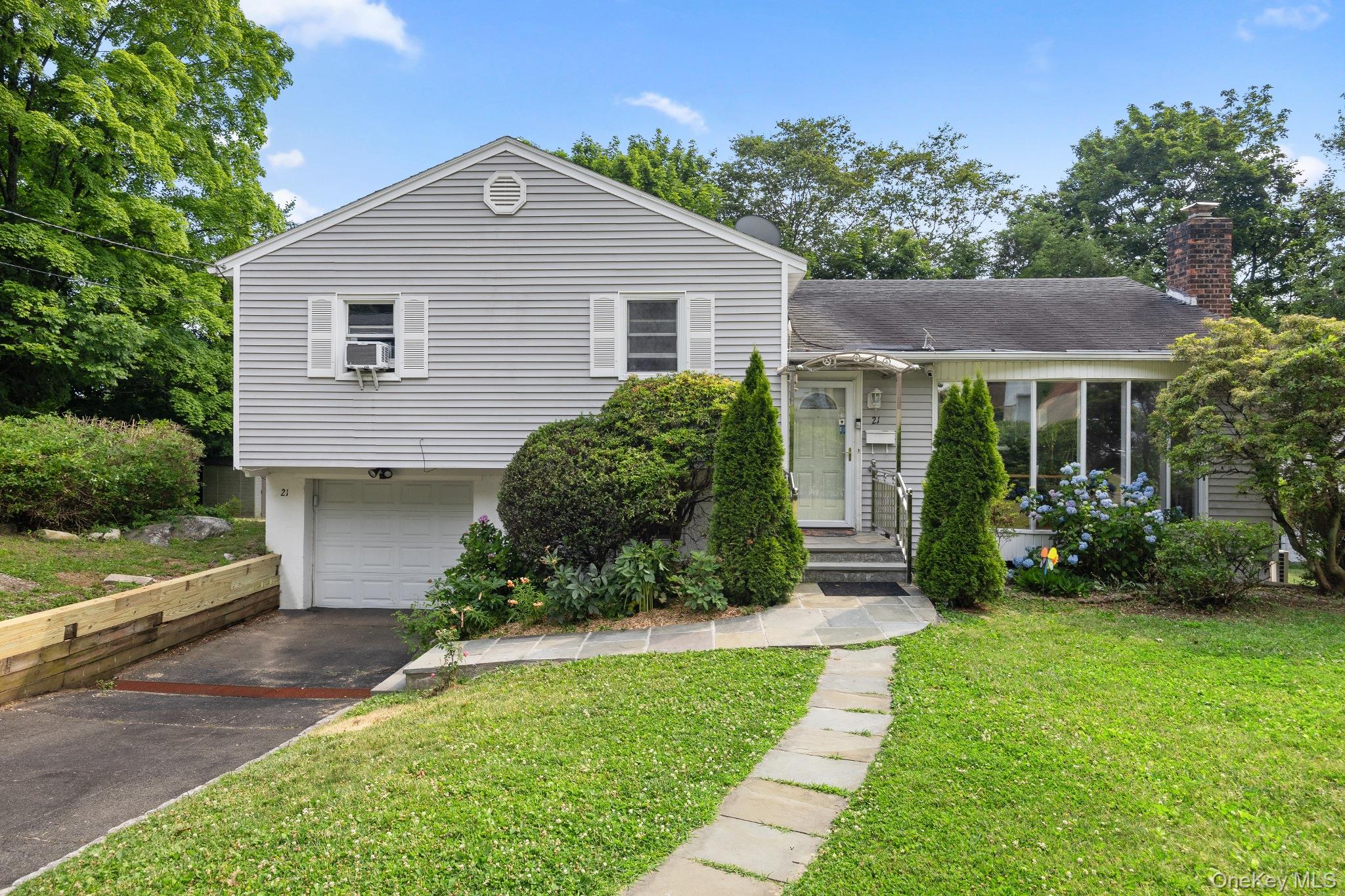 Move right into this beautifully updated home in the award-winning Ardsley School District, offering a highly functional layout, abundant natural light, and exceptional indoor-outdoor living.The main level welcomes you with a bright and spacious living room featuring an oversized wall of windows that fills the home with natural sunlight. The open-concept kitchen flows seamlessly into the dining area, creating the perfect setting for both everyday living and effortless entertaining.The second floor offers three generously sized bedrooms and a beautifully updated full bathroom. The lower level provides a spacious mudroom/sitting area with direct access to the backyard, along with a versatile office or guest bedroom.The finished basement adds valuable living space with a recreation/gym area, a full bathroom, laundry, and ample storage.Step outside to enjoy the level backyard, complete with an expansive patio, charming gazebo, and plenty of room for outdoor dining, entertaining, or relaxing. An additional parking space adds everyday convenience.Ideally situated on a quiet, tree-lined street, this move-in-ready home is just a short walk to Ardsley High School, parks, shopping, and transportation, offering the perfect combination of comfort, convenience, and location.