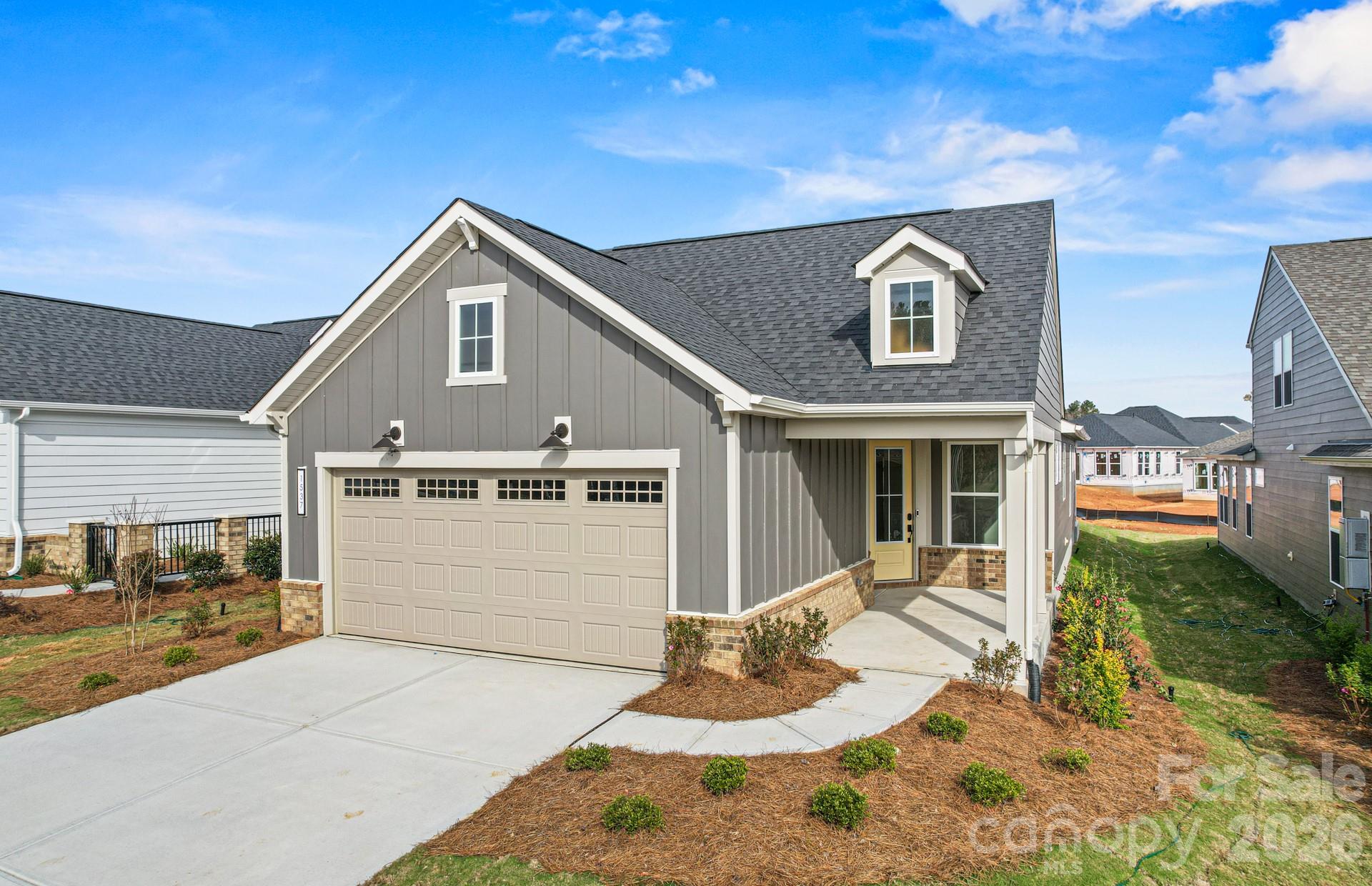 Welcome home to this stunning single-story new construction in Del Webb Carolina Ridge, Cabarrus County’s premier 55+ active adult community! This thoughtfully designed home blends timeless curb appeal with high-end finishes throughout. Community Amenities: Del Webb Carolina Ridge offers resort-style, low-maintenance 55+ living centered around a future 12,000 sq. ft. clubhouse with a modern fitness center, movement studio, and multipurpose gathering rooms. Residents will enjoy a resort-style outdoor pool, pickleball and bocce ball courts, a golf simulator and putting green, scenic walking trails, a dog park, and an open-air pavilion — all coordinated by a full-time Lifestyle Director with clubs, classes, and social events year-round. Ideally located in Midland, NC, just minutes from I-485, Mint Hill, Matthews, Harrisburg and Concord, Charlotte Motor Speedway, Concord Mills, and Uptown Charlotte, with easy access to shopping, dining, and healthcare. Don’t miss your opportunity to enjoy the best of active adult living — schedule your visit today!
