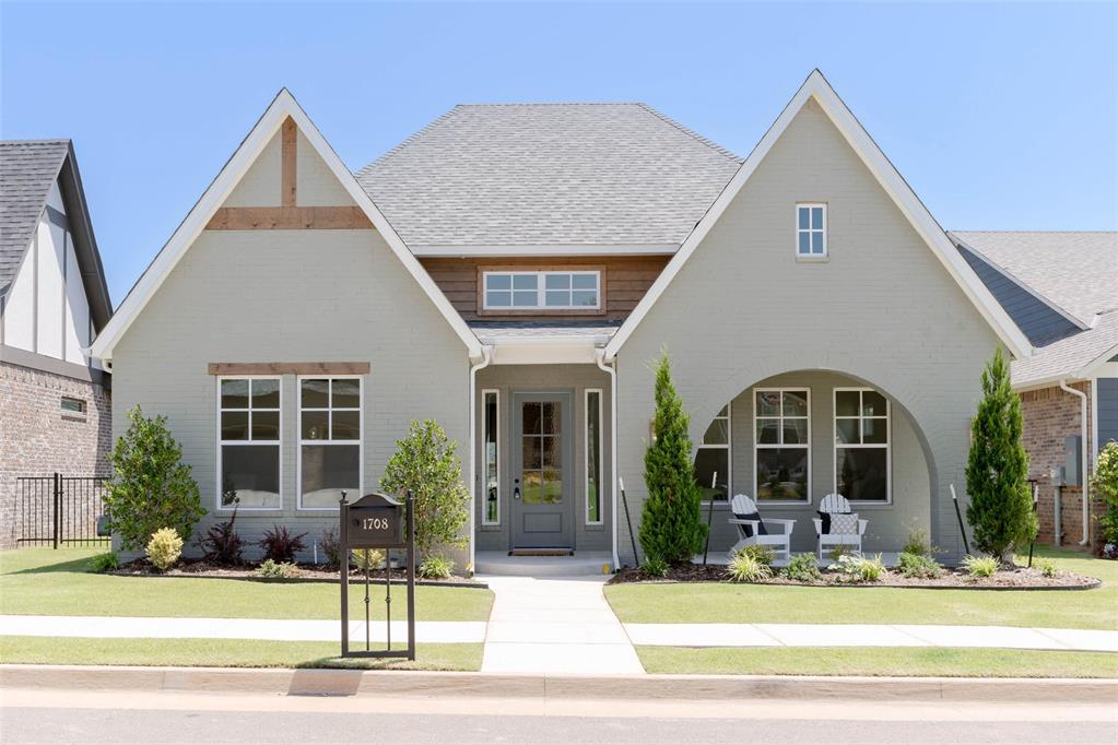 Step back in time with our Ellison plan in The Plaza at Town Square, featuring a beautifully painted Tudor exterior. Architectural brick arches frame the spacious front porch, complemented by warm wood accents that add a subtle modern touch. This thoughtfully designed 3 bedroom, 2 full bath home offers a study with French double doors, a cathedral living room accented with wood beams, and a window wall sliding door that fills the space with natural light and opens to the outdoor living area. A striking painted brick to ceiling fireplace with built-in media cabinets anchors the living room, while the open-concept kitchen and dining area create an inviting space for everyday living and entertaining. Site-finished wood flooring flows throughout the main living areas, study, and primary suite. The private primary retreat features a double vanity, a freestanding tub, an oversized spa-style glass shower, and a walk-in closet that conveniently connects to the laundry room. Located in The Plaza Phase 2—the final phase of Town Square—you’ll enjoy incredible community amenities including a community fishing pond, greenbelt with walking trails, community garden, and playground, along with access to the private Town Square Residents Club featuring a resort-style pool, fitness center, and more. Conveniently located near I-35 with easy access to dining and shopping in Edmond. Special Summer Promotion Available! For a limited time, enjoy $10,000 Your Way on select under construction or completed homes in The Plaza at Town Square. Use it towards a rate buydown, cash to close, design upgrades, appliance package, storm shelter options, or combine select incentives to fit your lifestyle best. Promotion available 5/28/26–7/31/26. Contact McCaleb Homes for full details.