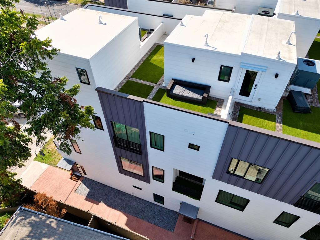 Secure a prime position in one of Dallas' fastest-growing neighborhoods. Steps from Lawnies, Mayers Garden, and Local Public Eatery, this multi-level condo puts the best of Knox-Henderson at your door, with the new Henderson mixed-use development expected to open within the next six months.Step inside to an open-concept living and dining area that flows into a kitchen with high-end finishes and Bosch appliances. A dedicated office or gym space adapts to however you work and live, and a private two-car garage makes coming and going easy. Multiple balconies bring the outdoors in on every level, and the private turfed rooftop terrace at the top is the ultimate setting for entertaining with downtown views.The primary suite has its own balcony and a dual-sink bath. The guest bedroom offers an en-suite bath and spacious closet. With the neighborhood growing around it, this is a rare chance to own a piece of Knox-Henderson's next chapter.