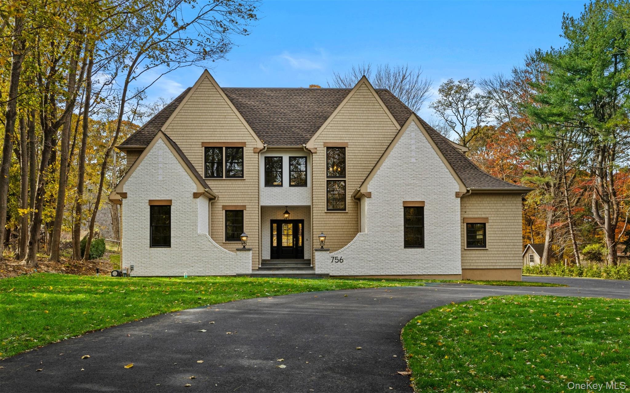 Welcome to a thoughtfully crafted 2025 Modern Colonial offering over 3,500 square feet of refined living space on a private, nearly 0.8-acre lot in Mount Sinai. Designed for those who appreciate both elegance and everyday comfort, this home blends timeless architecture with modern functionality, just minutes from the harbor, beaches, and top-rated schools.From the moment you enter, it’s clear this is not typical new construction. The home is distinguished by custom-milled window and door trim throughout — a level of craftsmanship rarely found in Northeast new builds — paired with wide-plank oak floors, 9-foot ceilings, and abundant natural light that elevate every room.The heart of the home is a stunning chef’s kitchen featuring a full Thermador appliance suite, quartz countertops, oversized island, and a butler’s pantry, seamlessly flowing into the open-concept living and dining areas. A gas fireplace anchors the living room, while expansive glass doors open to a covered bluestone lanai, creating effortless indoor-outdoor living ideal for entertaining or quiet evenings at home.A custom mudroom and laundry room with built-ins and sink add both beauty and practicality, while a first-floor primary suite offers a true retreat. The spa-inspired bath includes radiant-heated floors, soaking tub, rain shower, dual teak vanities, and a generous walk-in closet designed for comfort and ease.Upstairs, you’ll find four bedrooms, two of which feature are enhanced by vaulted ceilings that add an airy touch to the space. There’s also a versatile game room, a dedicated office, and a hidden bonus room tucked behind a custom Murphy bookcase door—perfect for guests, hobbies, or a private retreat. Every area is thoughtfully designed with a focus on balance, comfort, and livability.Additional highlights include three-zone HVAC, propane heating and cooking, in-ground irrigation, 300-amp electric service, and a full basement with 9-foot ceilings and outside entrance — offering exceptional flexibility for future living or recreation space.This is a home where craftsmanship, scale, and setting come together — offering privacy, peace, and a level of finish that stands apart. A rare opportunity to own a truly custom-built residence in one of Mount Sinai’s most desirable locations.